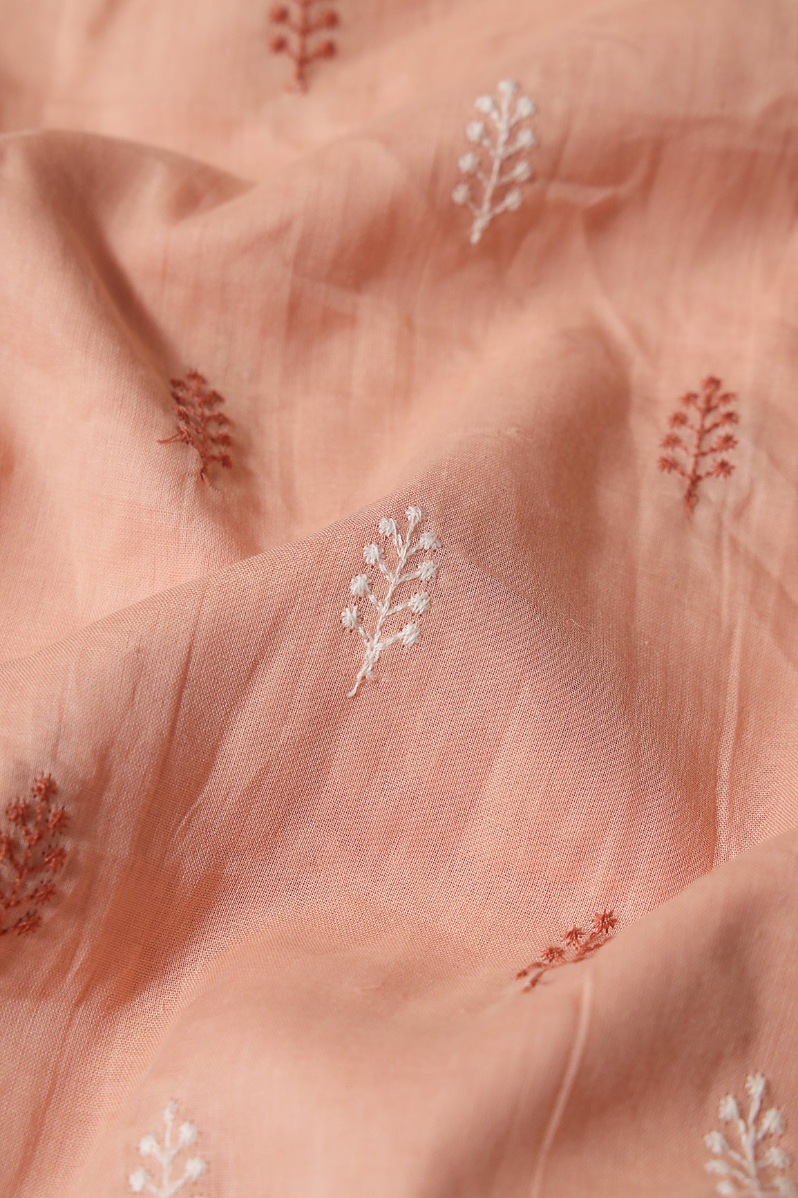 Peach And White Thread Leafy Embroidery On Peach Pure Mul Cotton Fabric