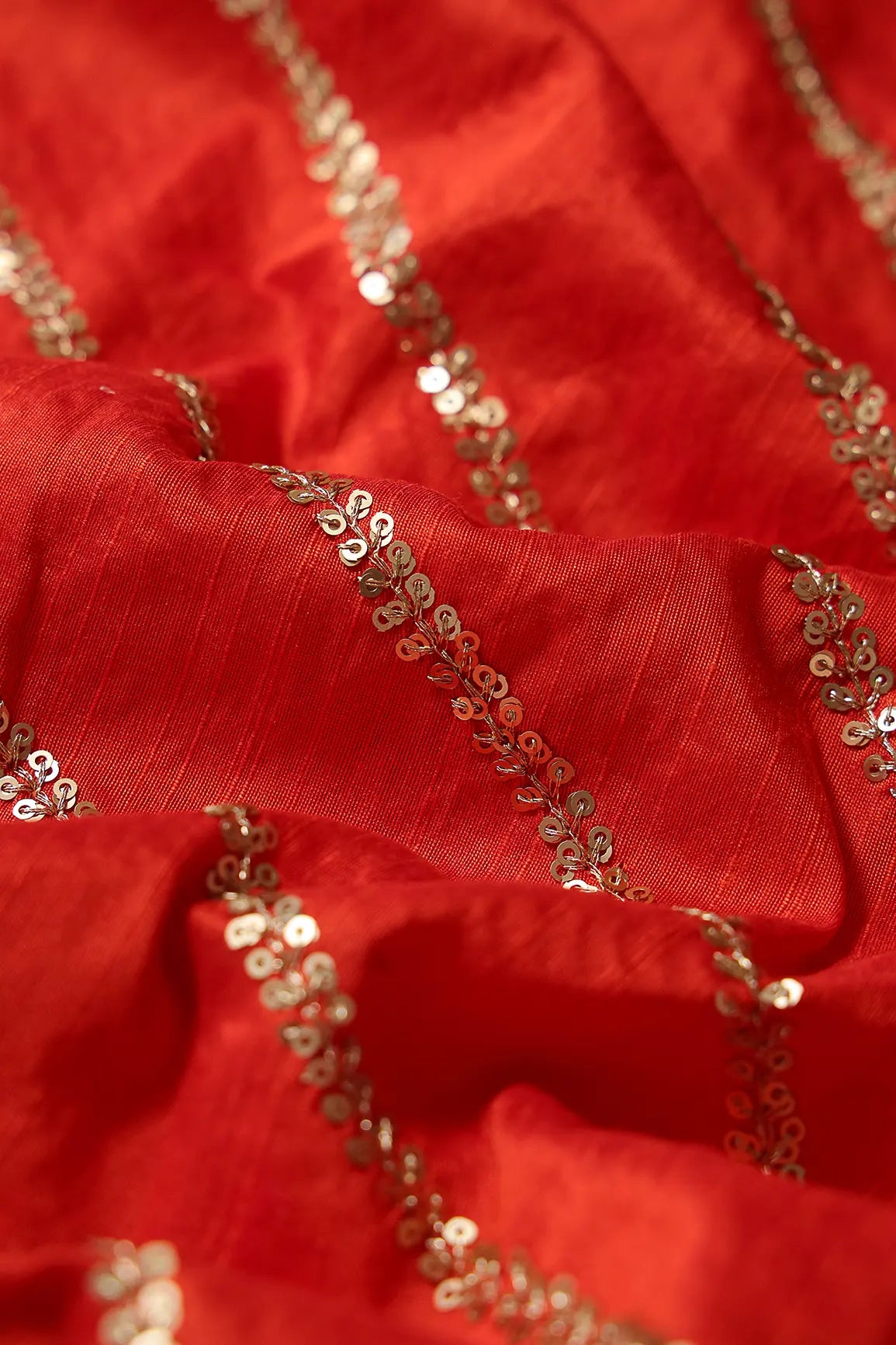 Gold Sequins With Gold Zari Stripes Embroidery Work On Dark Orange Raw Silk Fabric