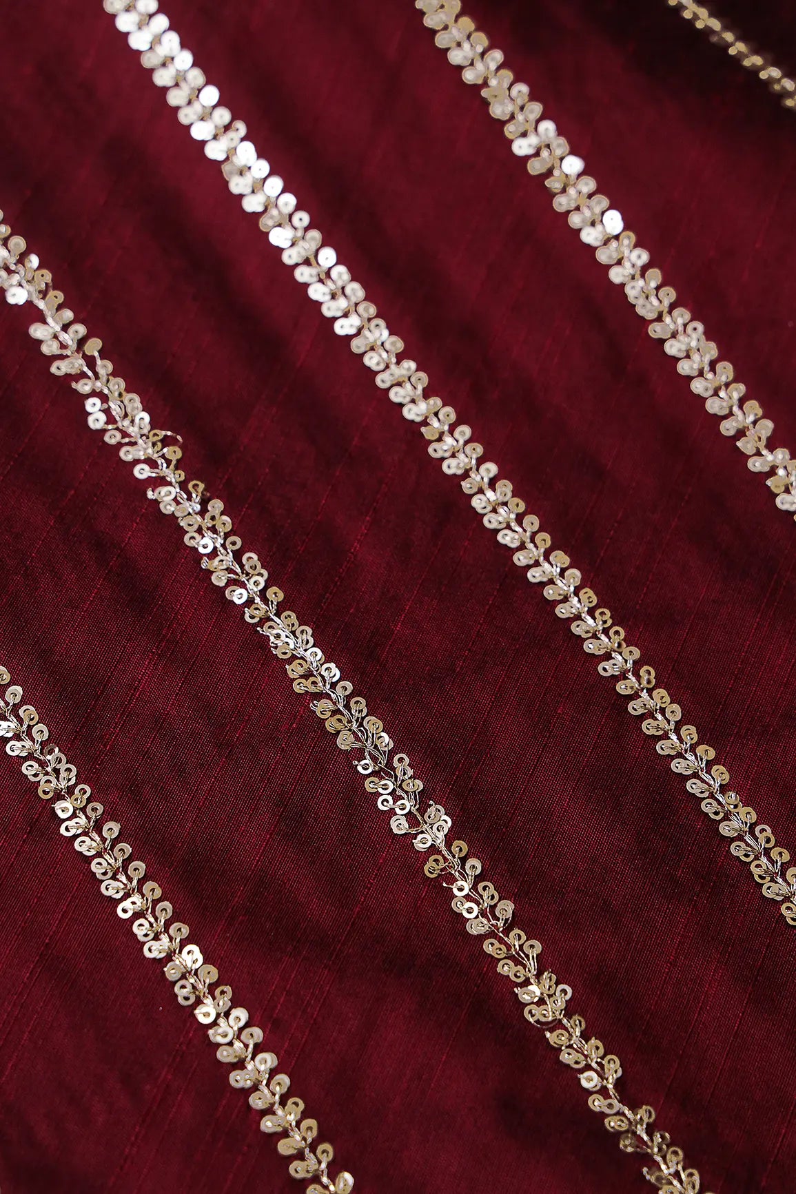 Gold Sequins With Gold Zari Stripes Embroidery Work On Dark Maroon Raw Silk Fabric