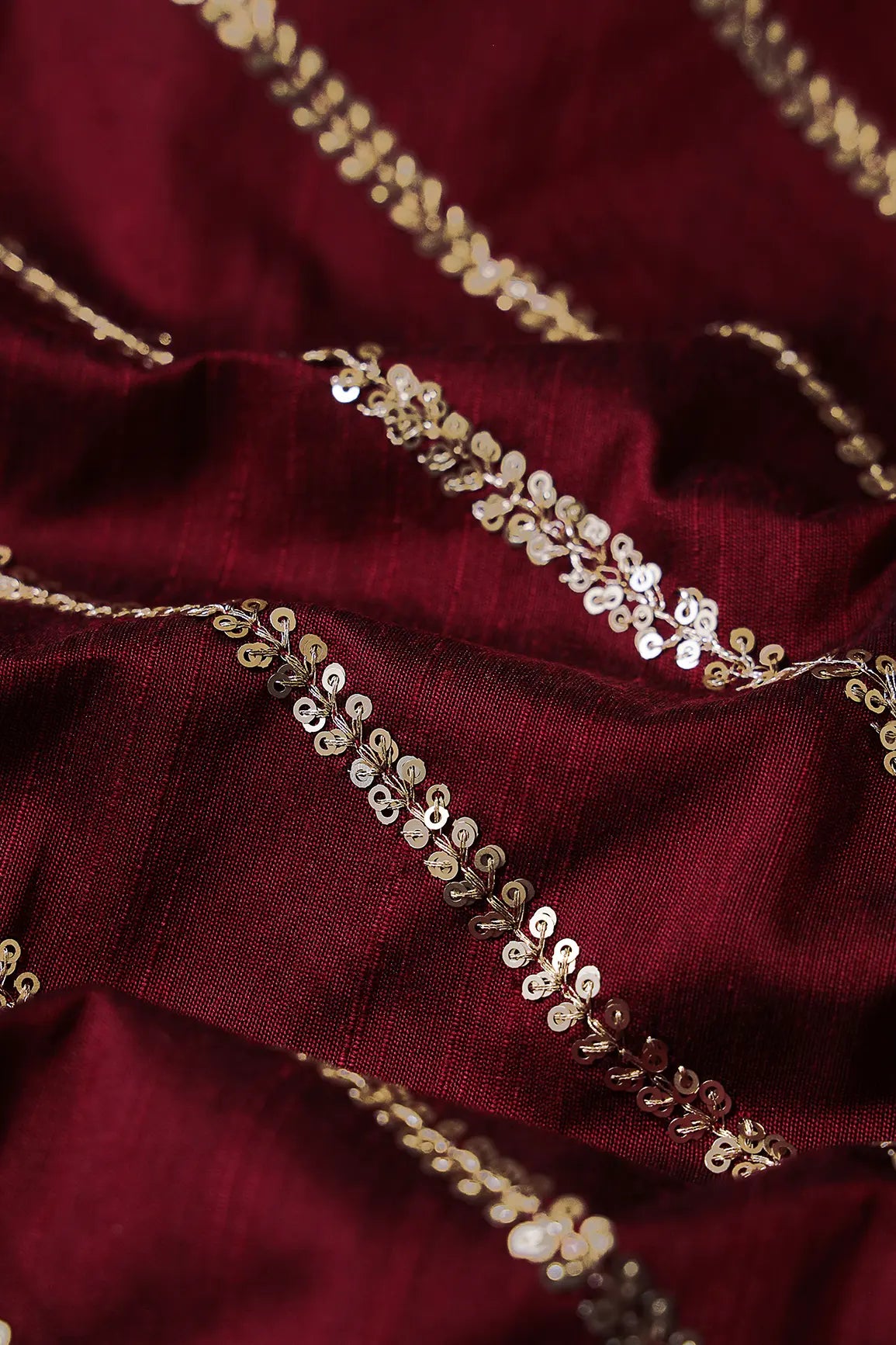 Gold Sequins With Gold Zari Stripes Embroidery Work On Dark Maroon Raw Silk Fabric