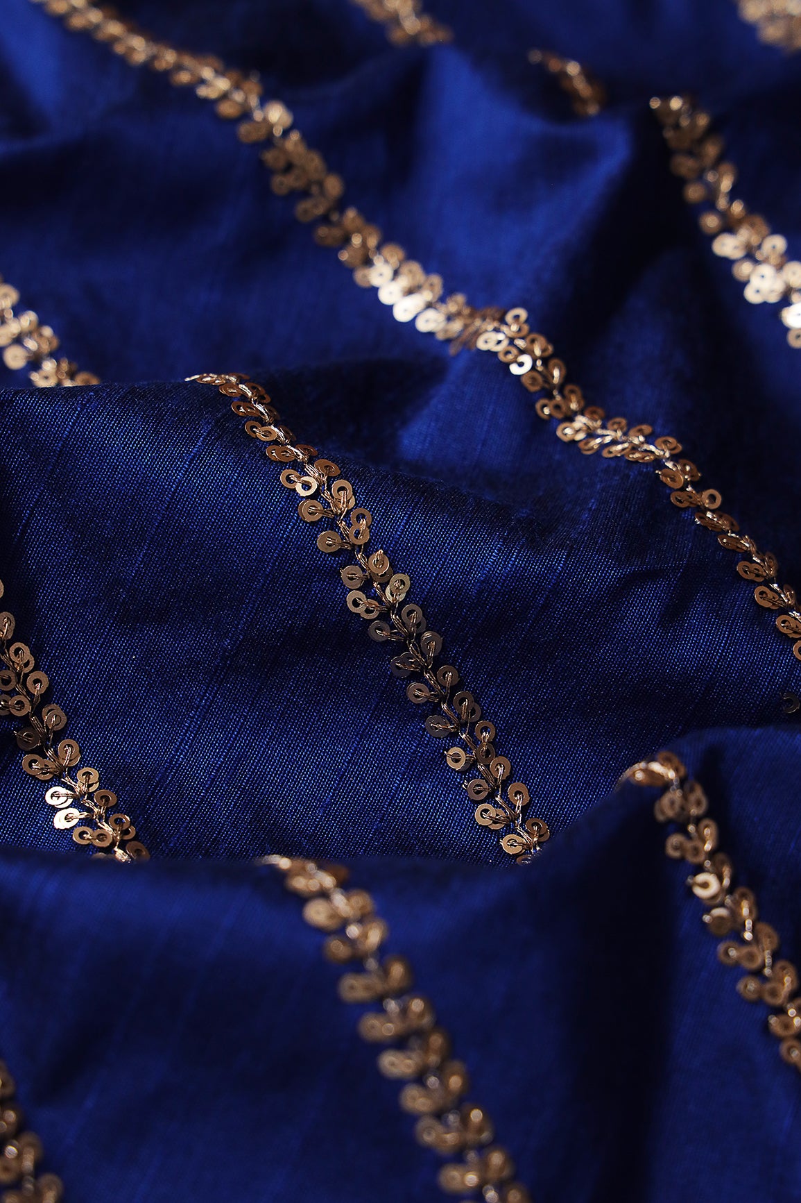 Gold Sequins With Gold Zari Stripes Embroidery Work On Royal Blue Raw Silk Fabric