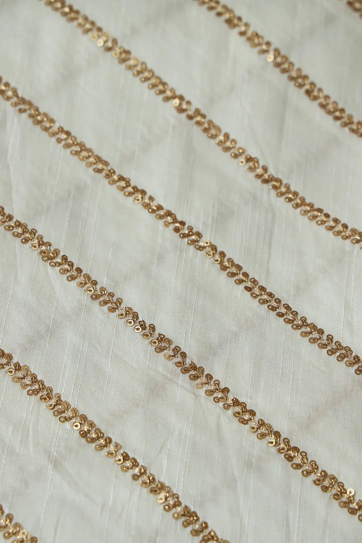 Gold Sequins With Gold Zari Stripes Embroidery Work On White Raw Silk Fabric