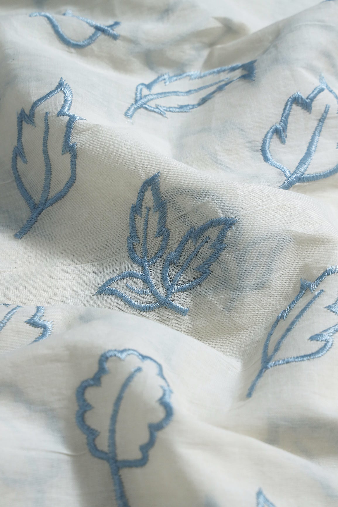 Beautiful Blue Leafy Embroidery On Off White Organic Cotton Fabric