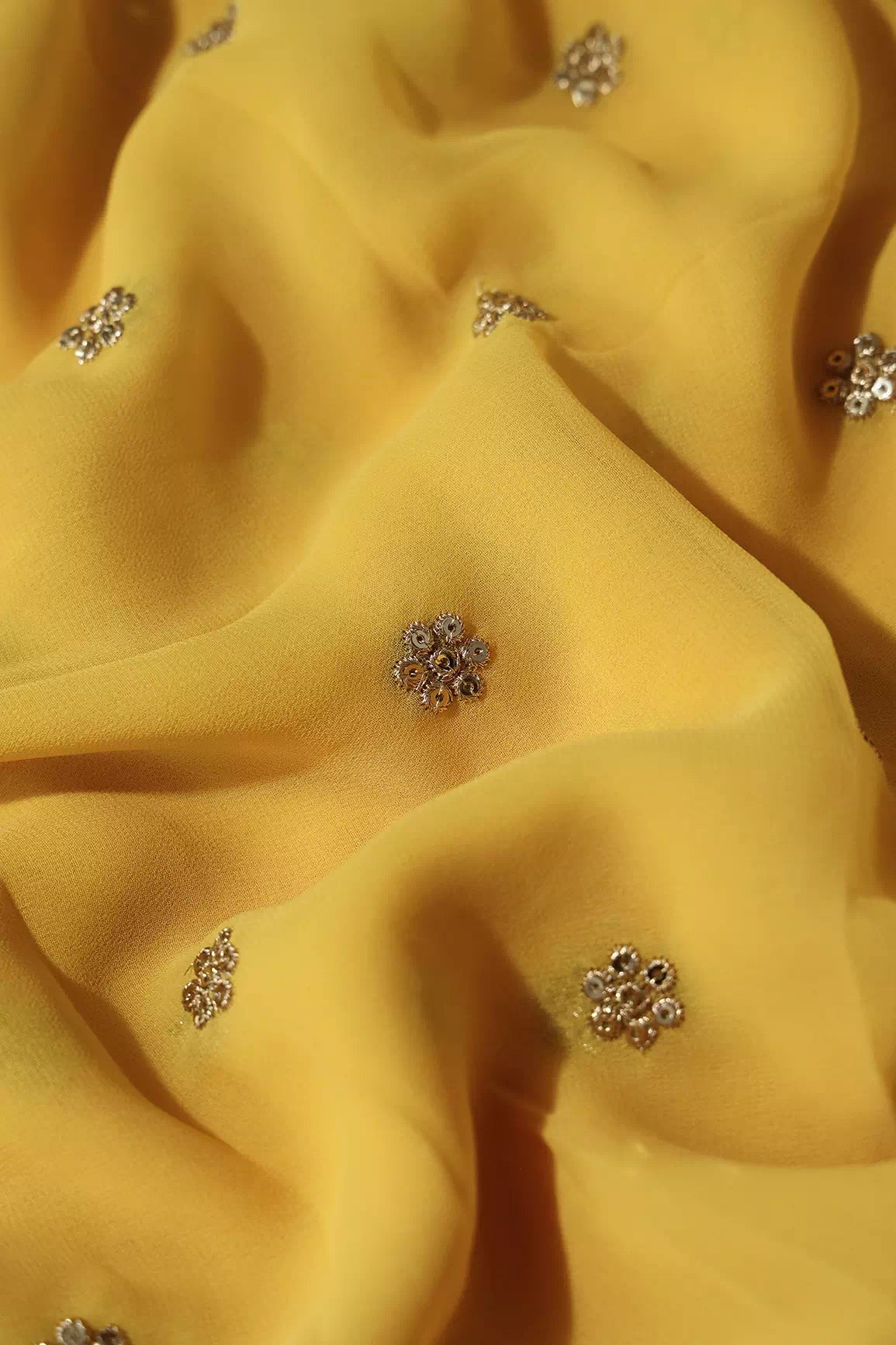 Gold Sequins With Gold Zari Small Motif Embroidery Work On Yellow Viscose Georgette Fabric