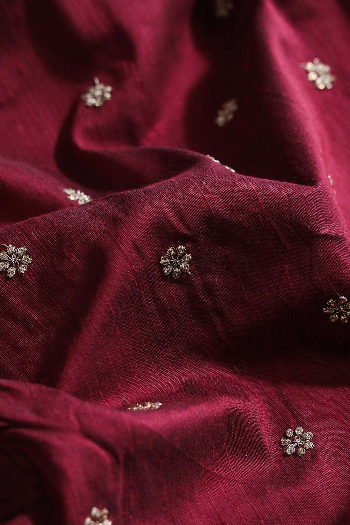 Gold Sequins With Gold Zari Small Motif Embroidery Work On Maroon Raw Silk Fabric