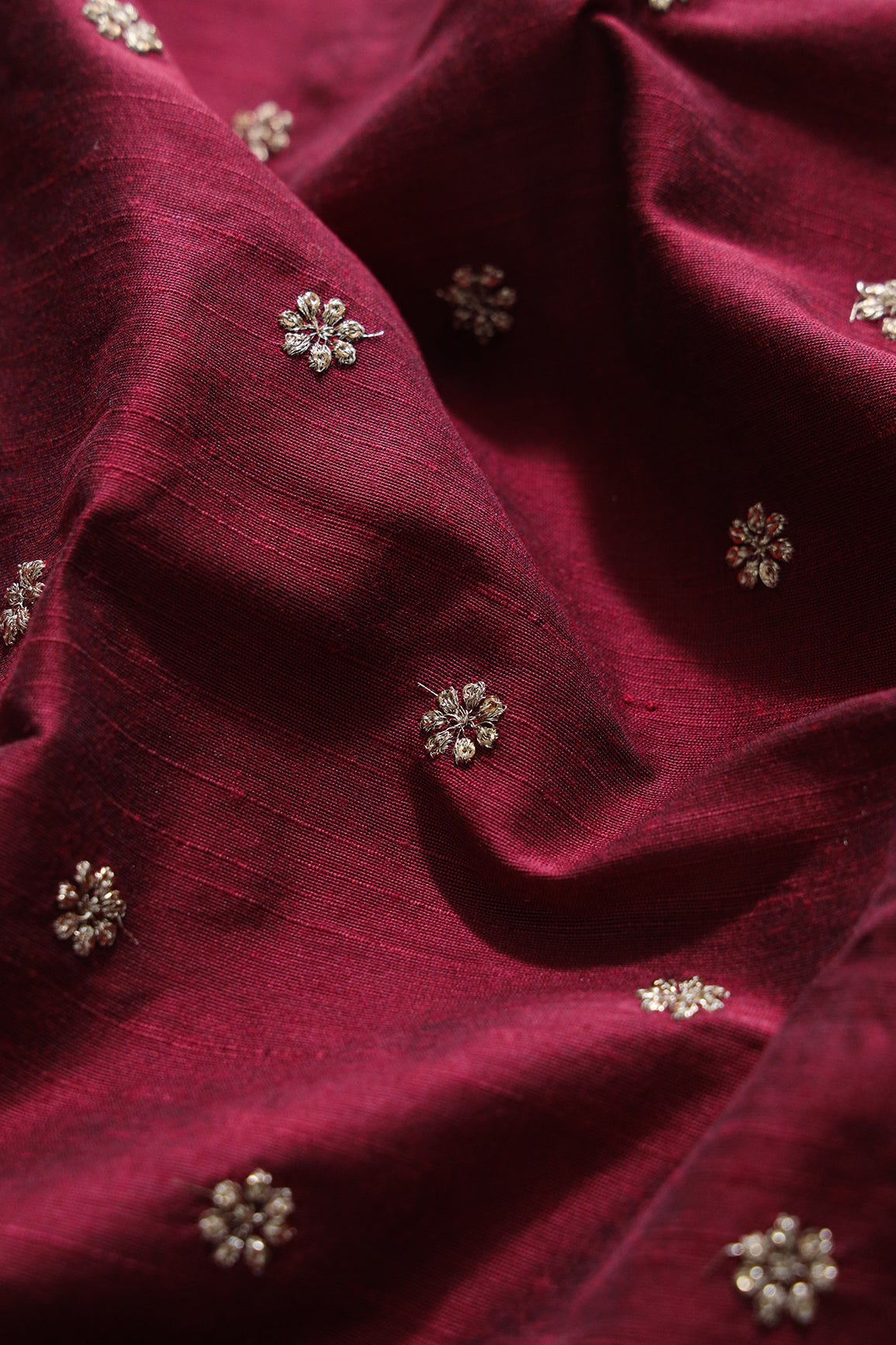 Gold Sequins With Gold Zari Small Motif Embroidery Work On Maroon Raw Silk Fabric