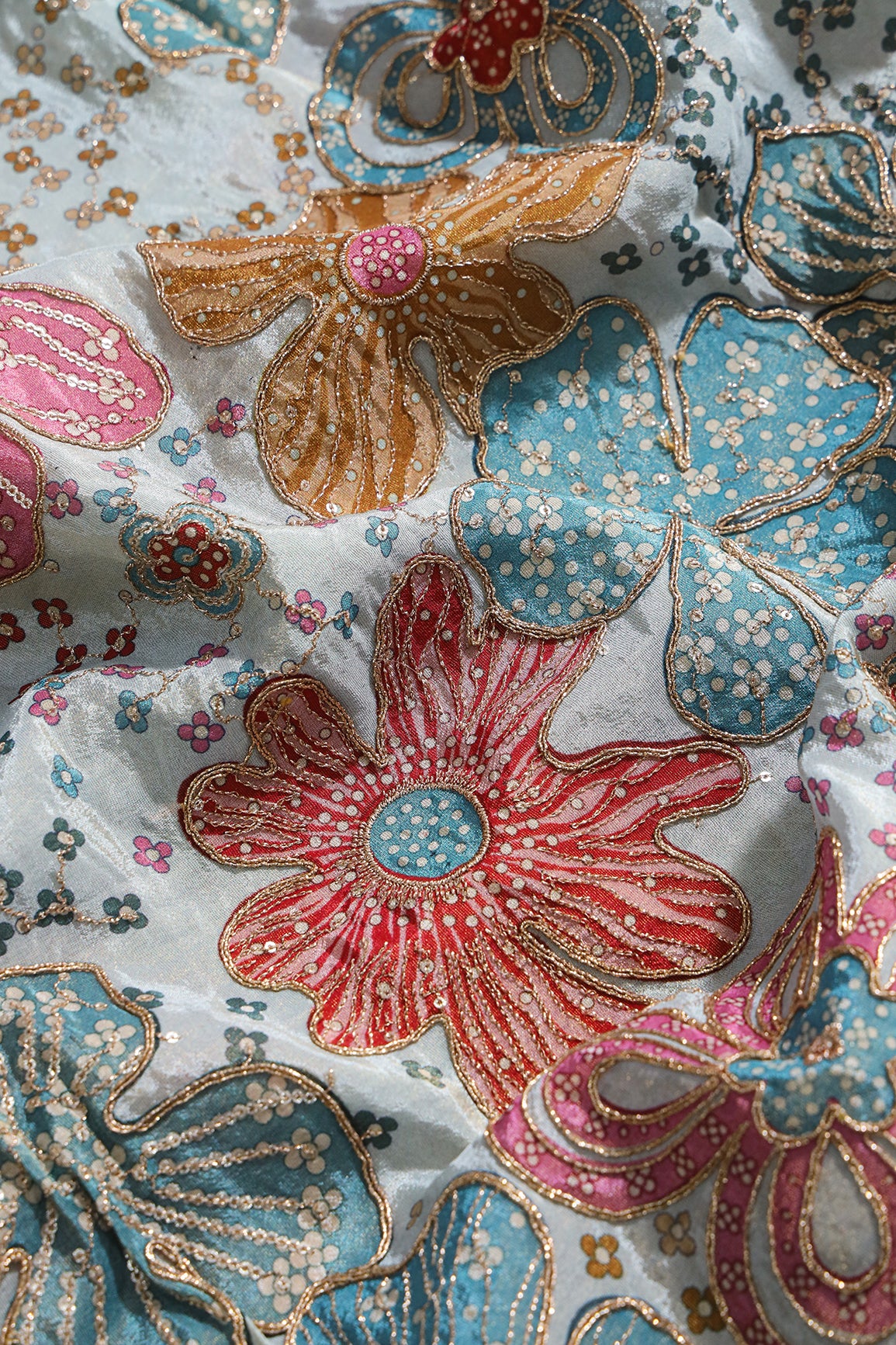 Floral Position Print On Sequins With Zari Embroidery On Pastel Blue Viscose Zari Tissue Fabric