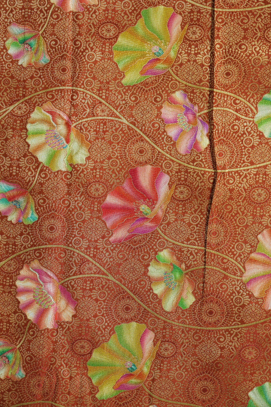 Positional Print On Rust Viscose Dola Silk Jacquard Fabric