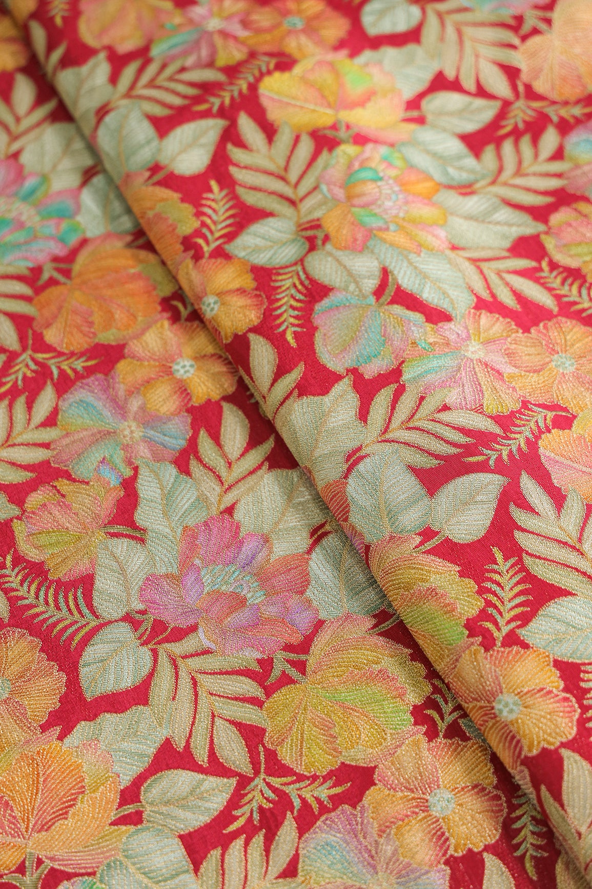 Positional Floral Print On Red Viscose Dola Silk Jacquard Fabric