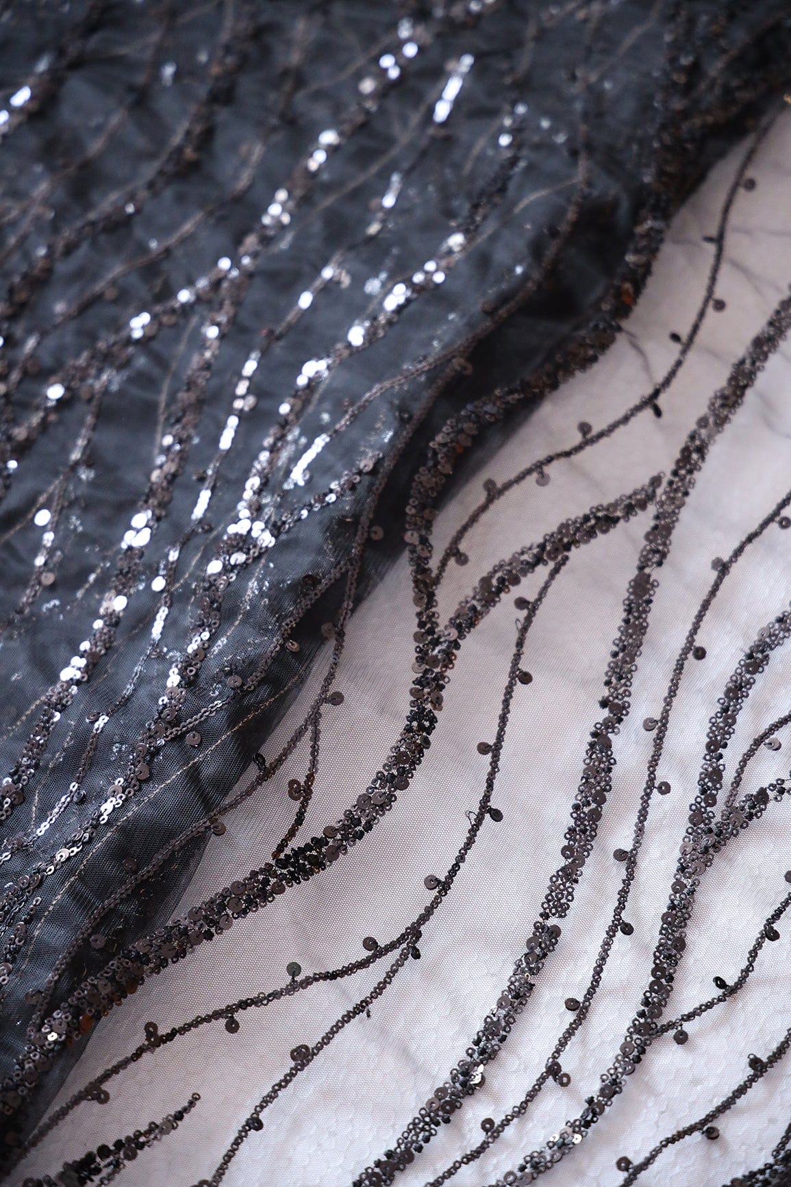 Beautiful Sequins With Black Thread Wavy Embroidery Work On Black Soft Net Fabric - doeraa