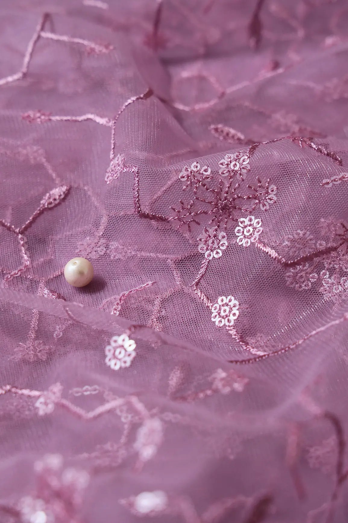 Beautiful Water Sequins Small Floral Embroidery On Mauve Soft Net Fabric - doeraa