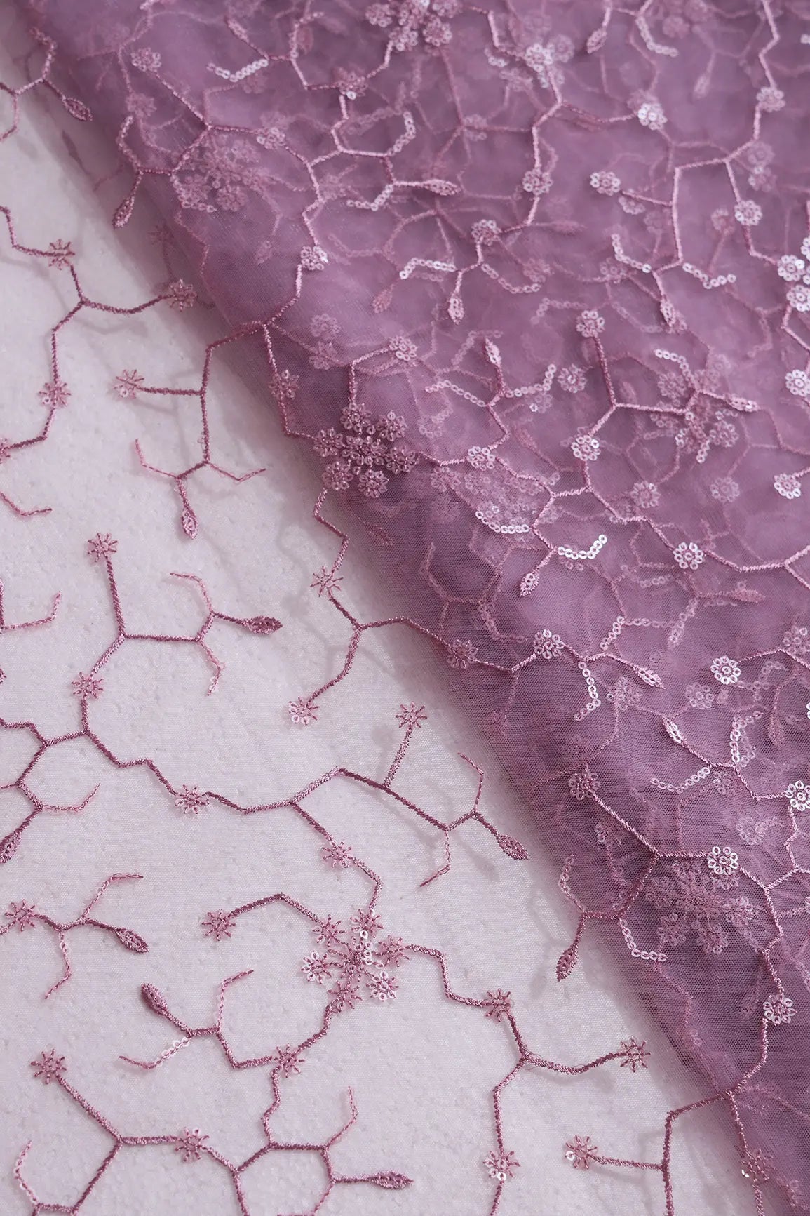 Beautiful Water Sequins Small Floral Embroidery On Mauve Soft Net Fabric - doeraa