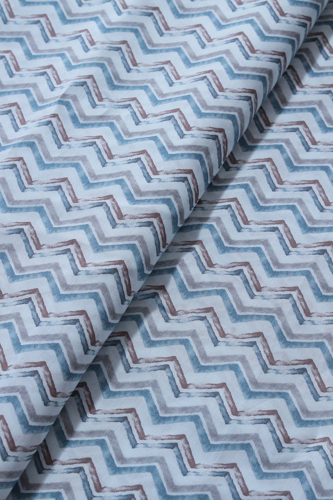 Blue And Brown Chevron Print On Pastel Blue Viscose Chanderi Silk Fabric - doeraa
