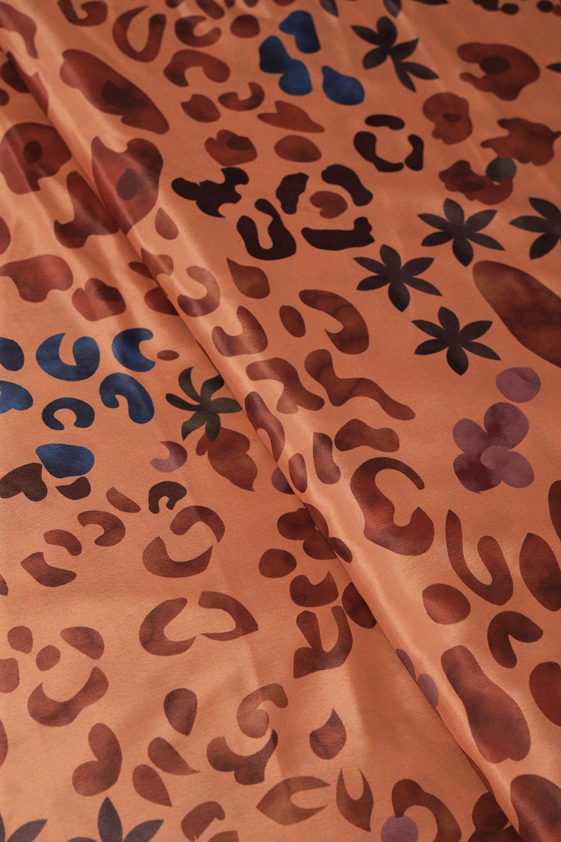 Brown And Blue Abstract Print On Pastel Orange Crepe Fabric - doeraa