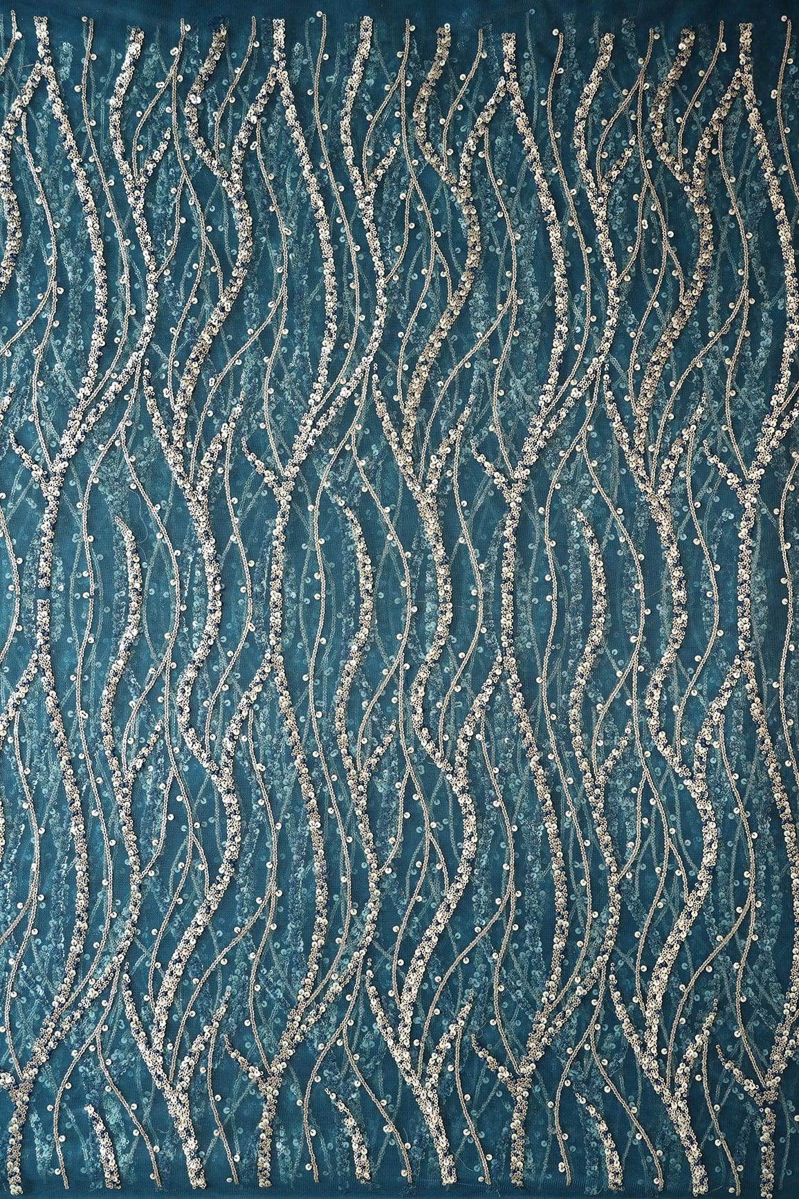 Gold And Silver Sequins With Blue Thread Wavy Embroidery Work On Rama Blue Soft Net Fabric - doeraa