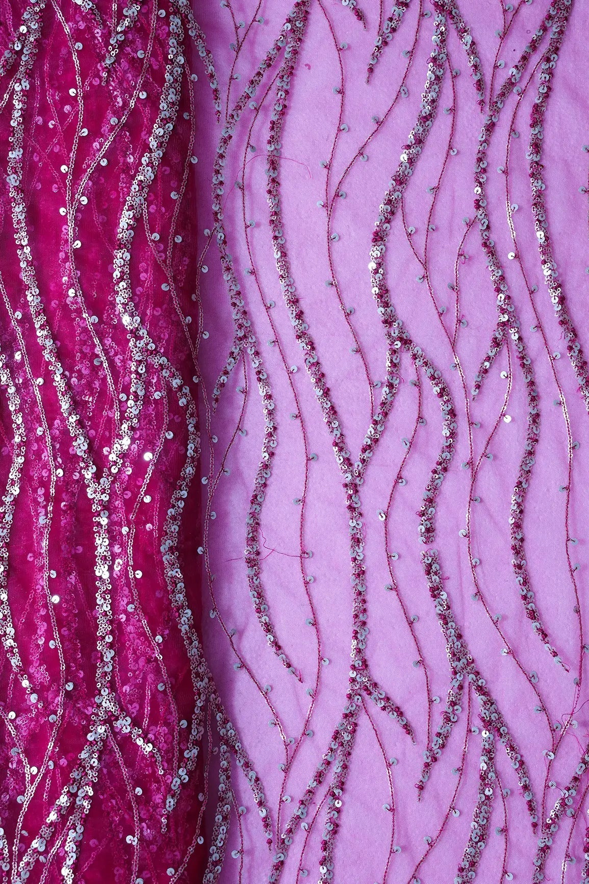 Gold And Silver Sequins With Fuchsia Thread Wavy Embroidery Work On Fuchsia Soft Net Fabric - doeraa