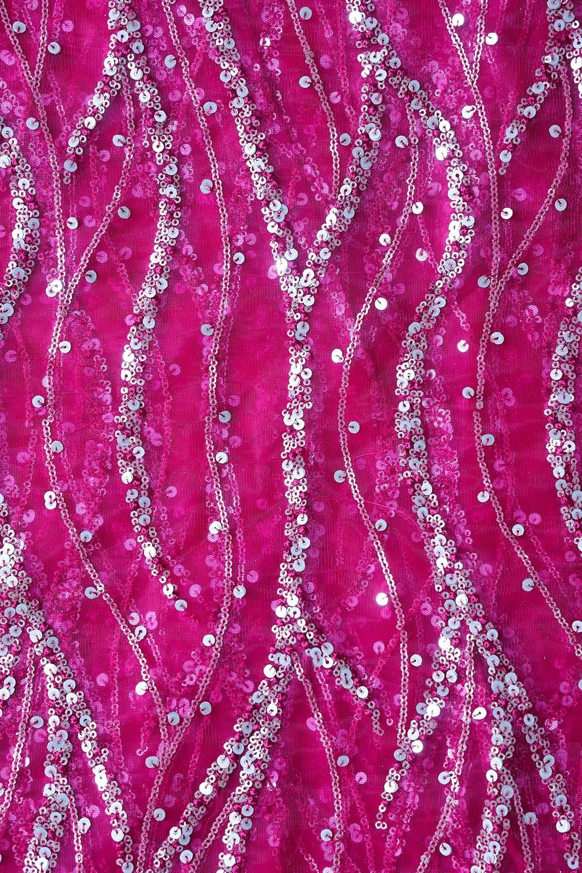 Gold And Silver Sequins With Fuchsia Thread Wavy Embroidery Work On Fuchsia Soft Net Fabric - doeraa