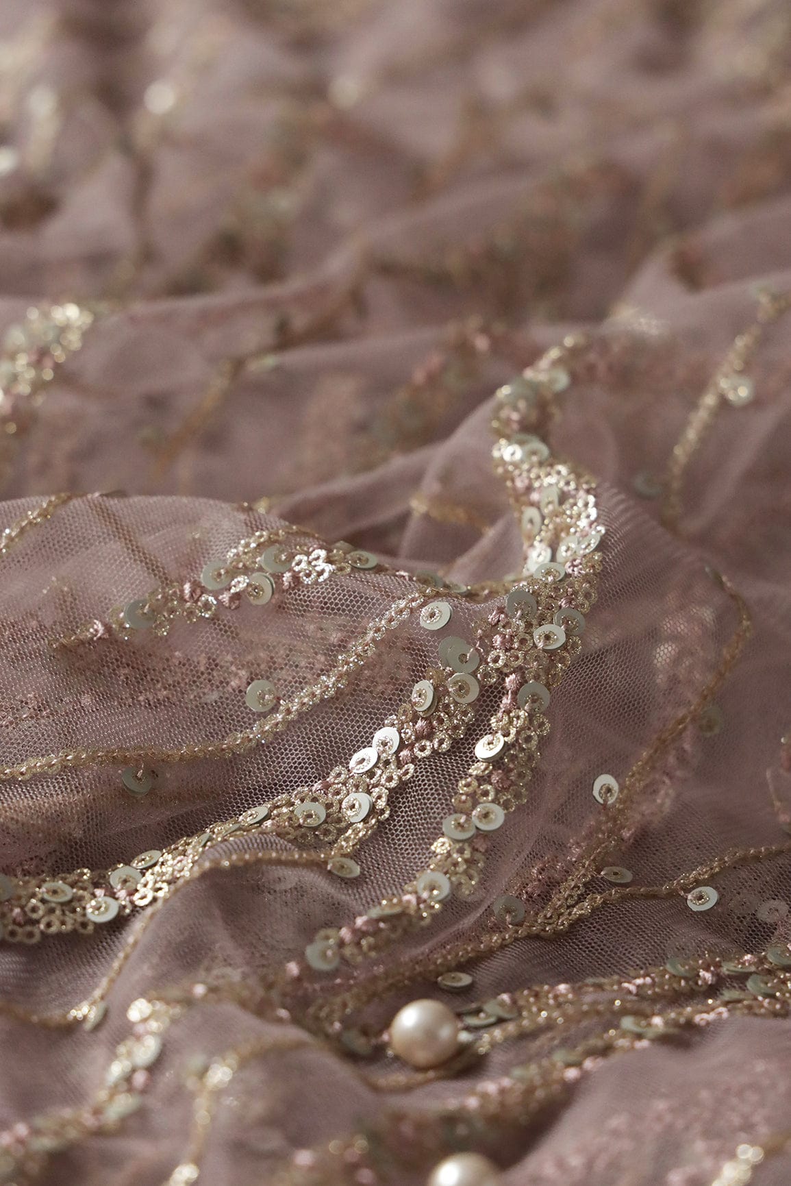 Gold And Silver Sequins With Mauve Thread Wavy Embroidery Work On Mauve Soft Net Fabric - doeraa