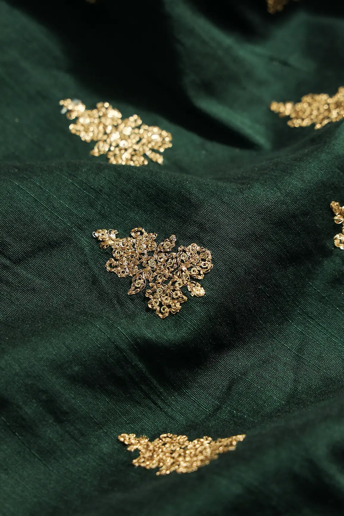Gold Sequins With Gold Zari Big Motif Embroidery Work On Bottle Green Raw Silk Fabric - doeraa