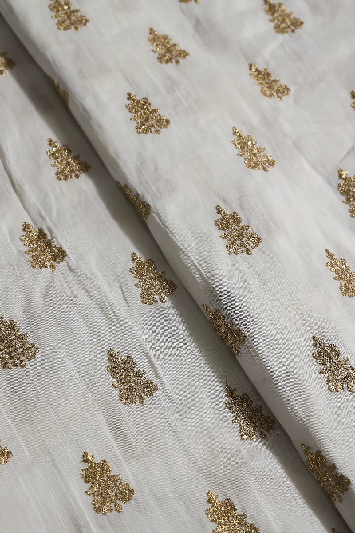 Gold Sequins With Gold Zari Big Motif Embroidery Work On White Raw Silk Fabric - doeraa