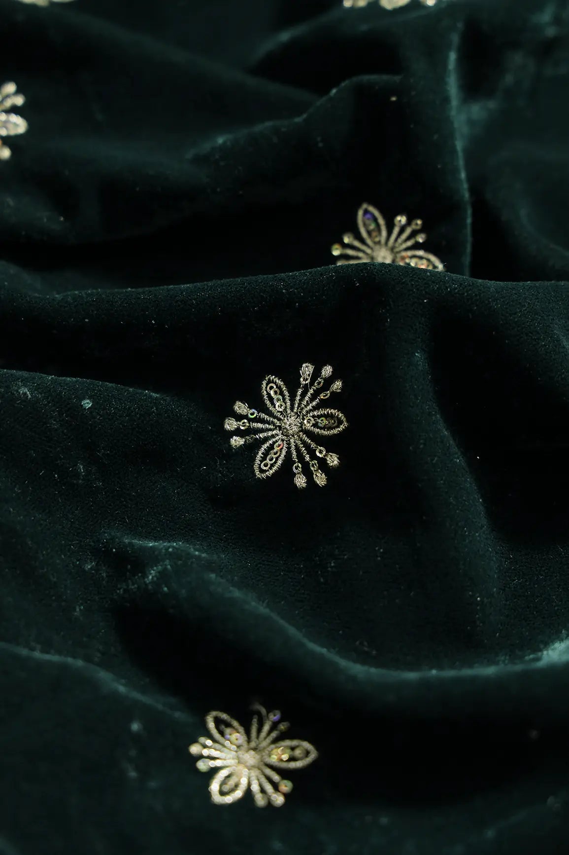 Gold Sequins With Gold Zari Small Floral Motif Embroidery Work On Bottle Green Velvet Fabric - doeraa