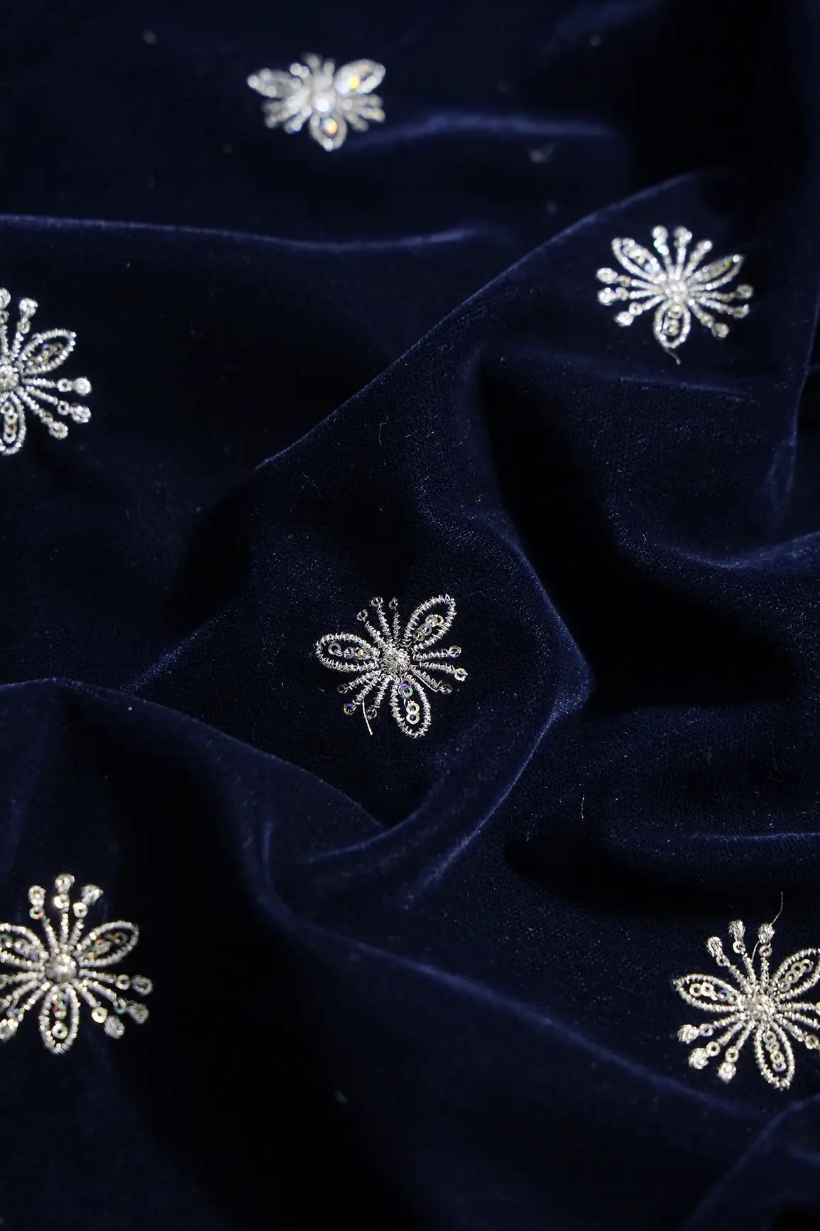 Gold Sequins With Gold Zari Small Floral Motif Embroidery Work On Navy Blue Velvet Fabric - doeraa