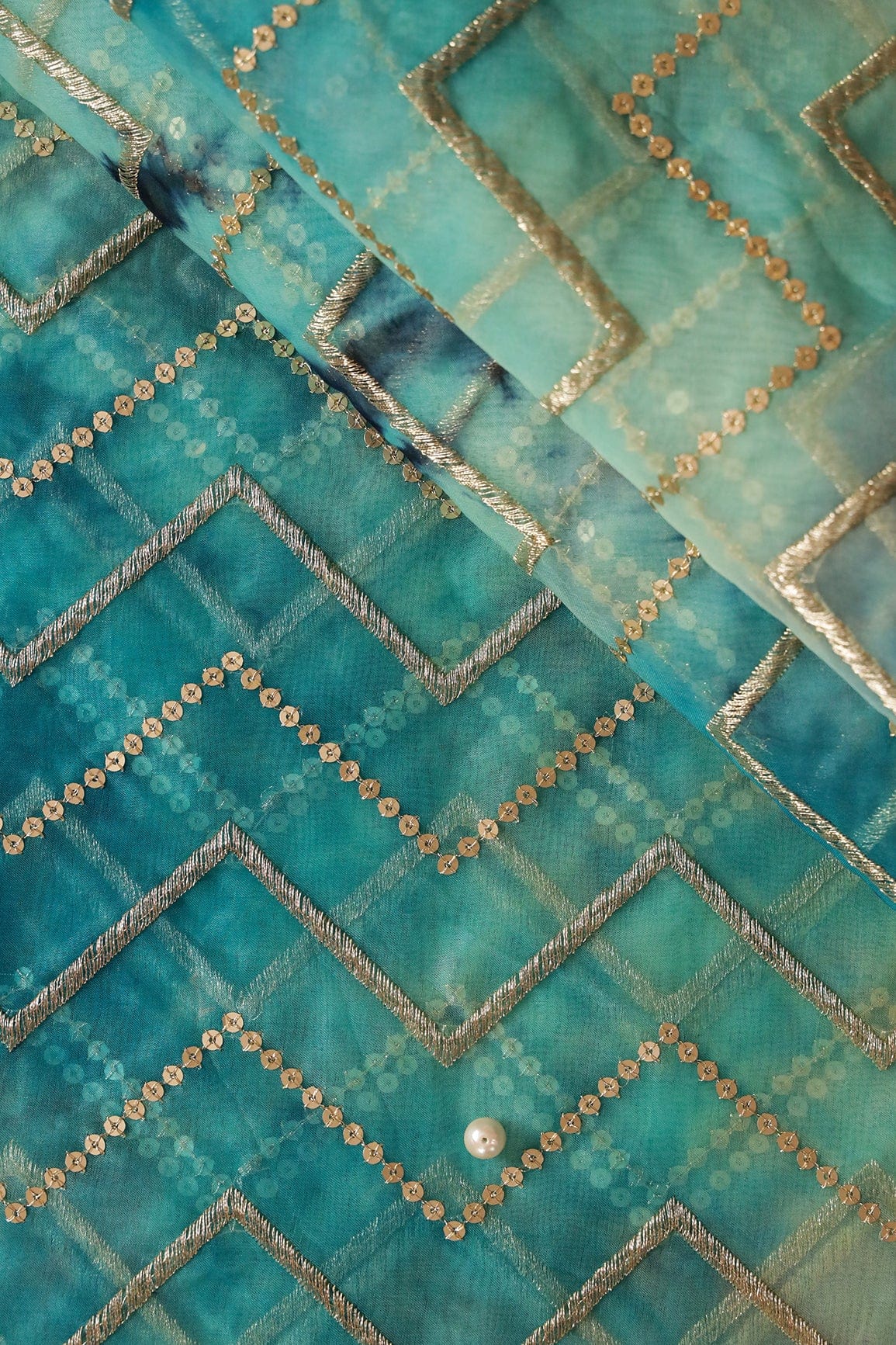 Gold Zari With Gold Sequins Chevron Embroidery Work On Tie & Dye Turquoise And Light Blue Organza Fabric - doeraa