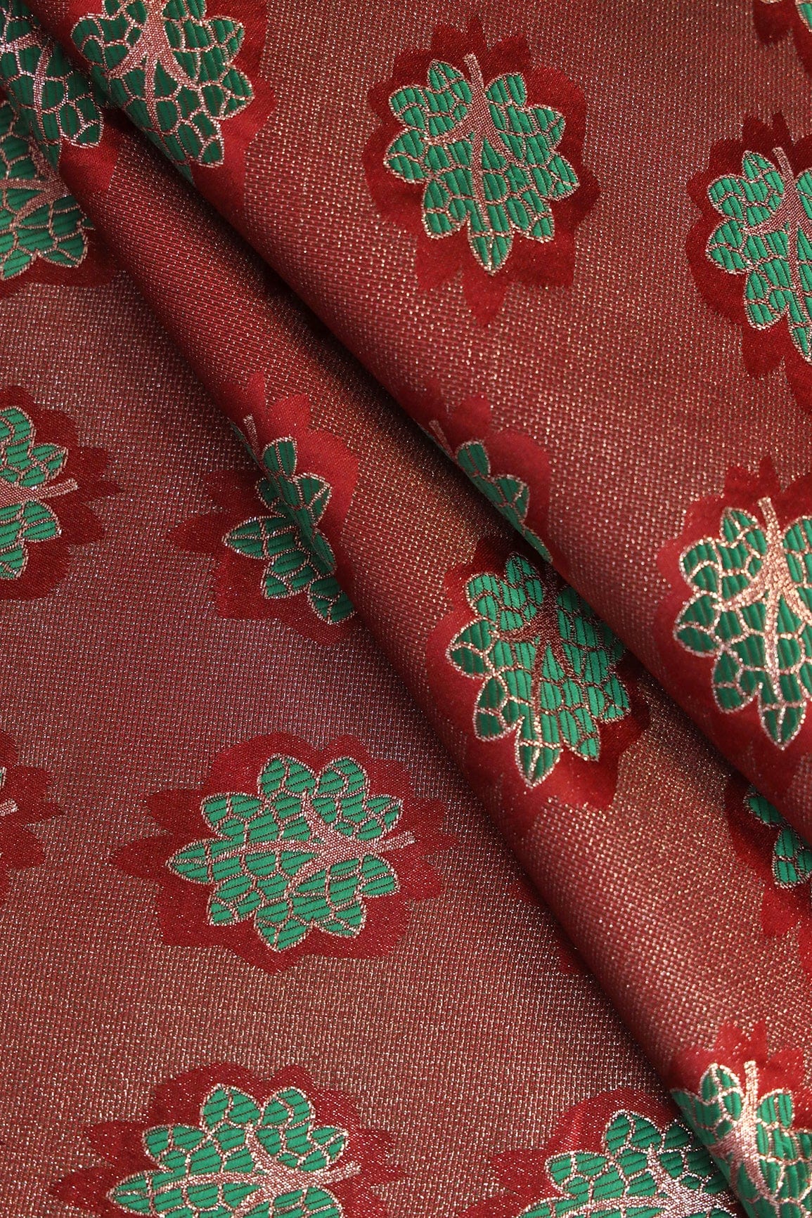 Maroon And Green Leafy Jute Banarasi Zari Jacquard Fabric - doeraa