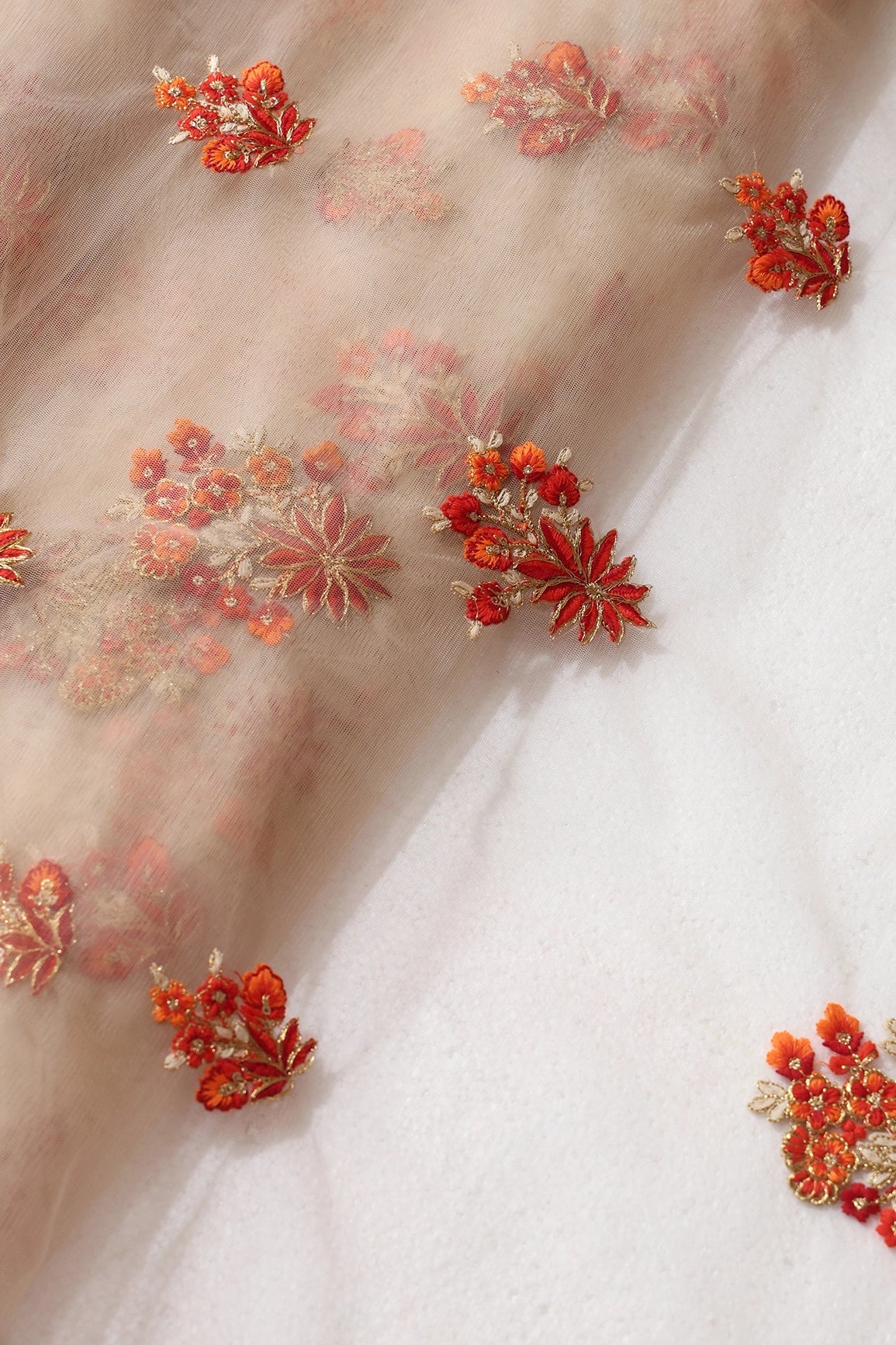 Orange And Beige Thread With Gold Zari Floral Butta Embroidery On Beige Soft Net Fabric - doeraa