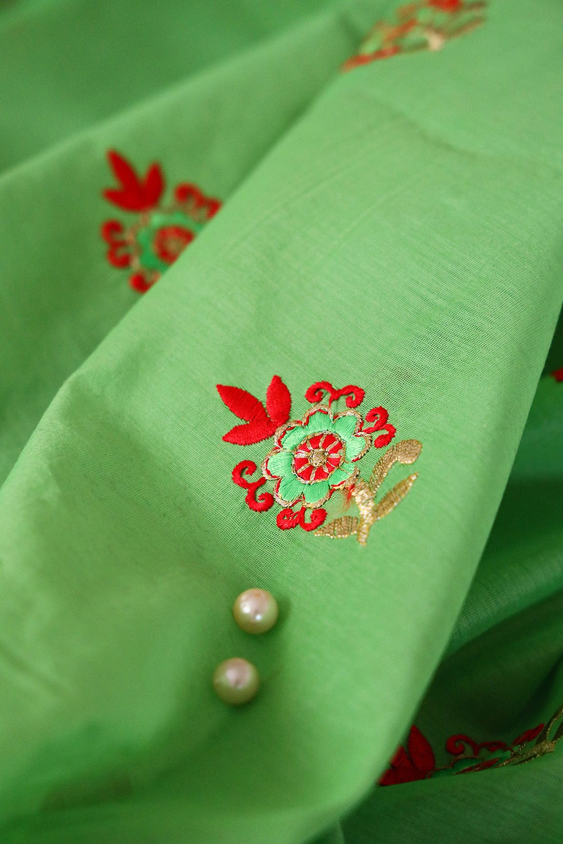 Orange And Green Floral Embroidery On Parrot Green Chanderi Fabric - doeraa