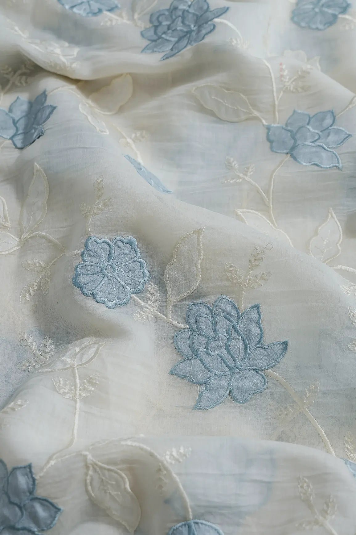 Pastel Sky Blue Thread Elegant Floral Embroidery Work On Off White Organic Cotton Fabric