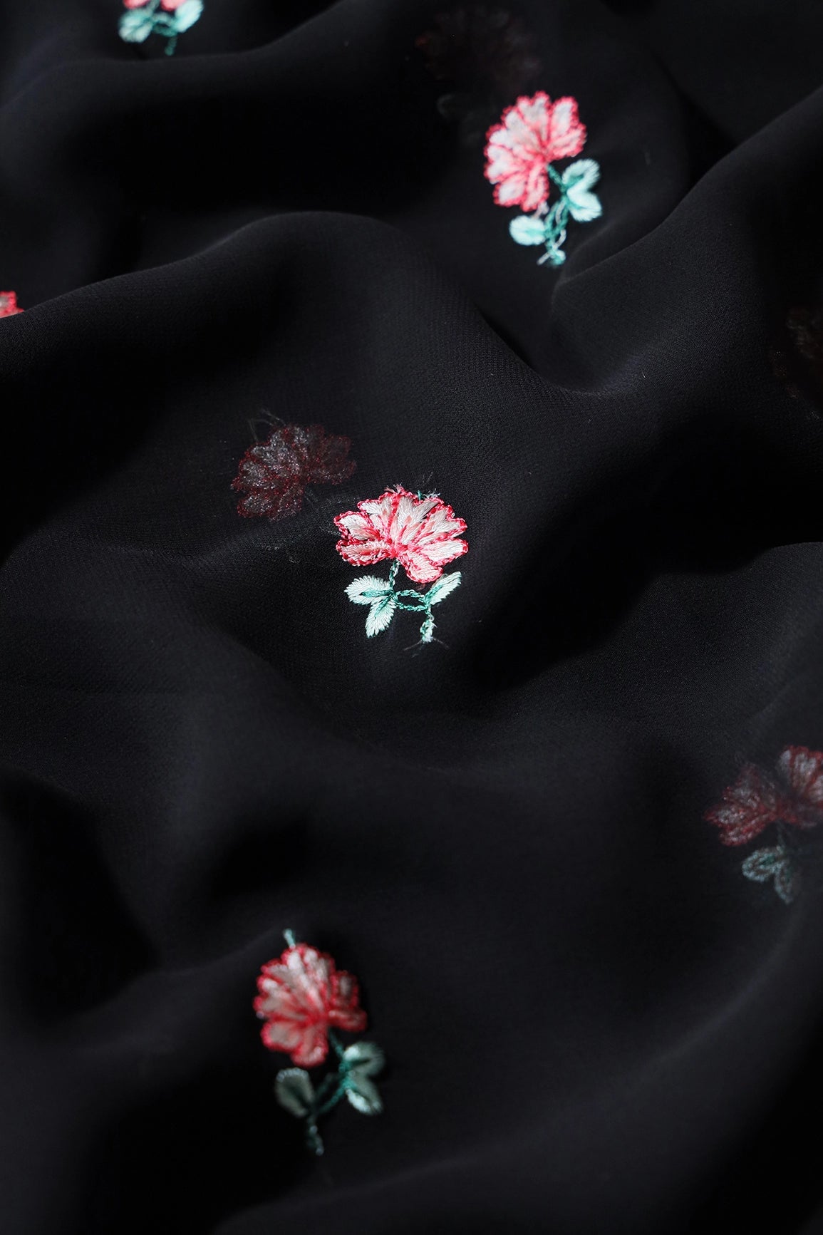 Peach And Green Small Floral Booti Embroidery On Black Georgette Fabric - doeraa