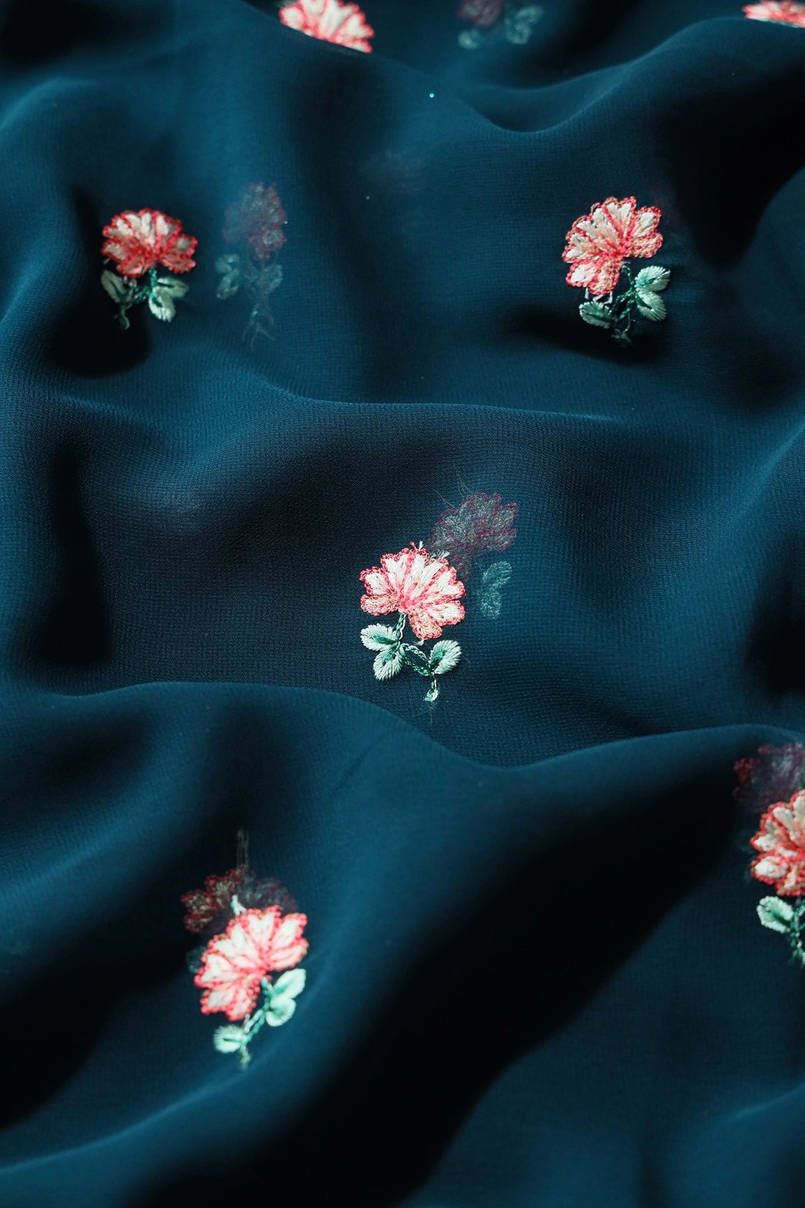 Peach And Green Small Floral Booti Embroidery On Prussian Blue Georgette Fabric - doeraa