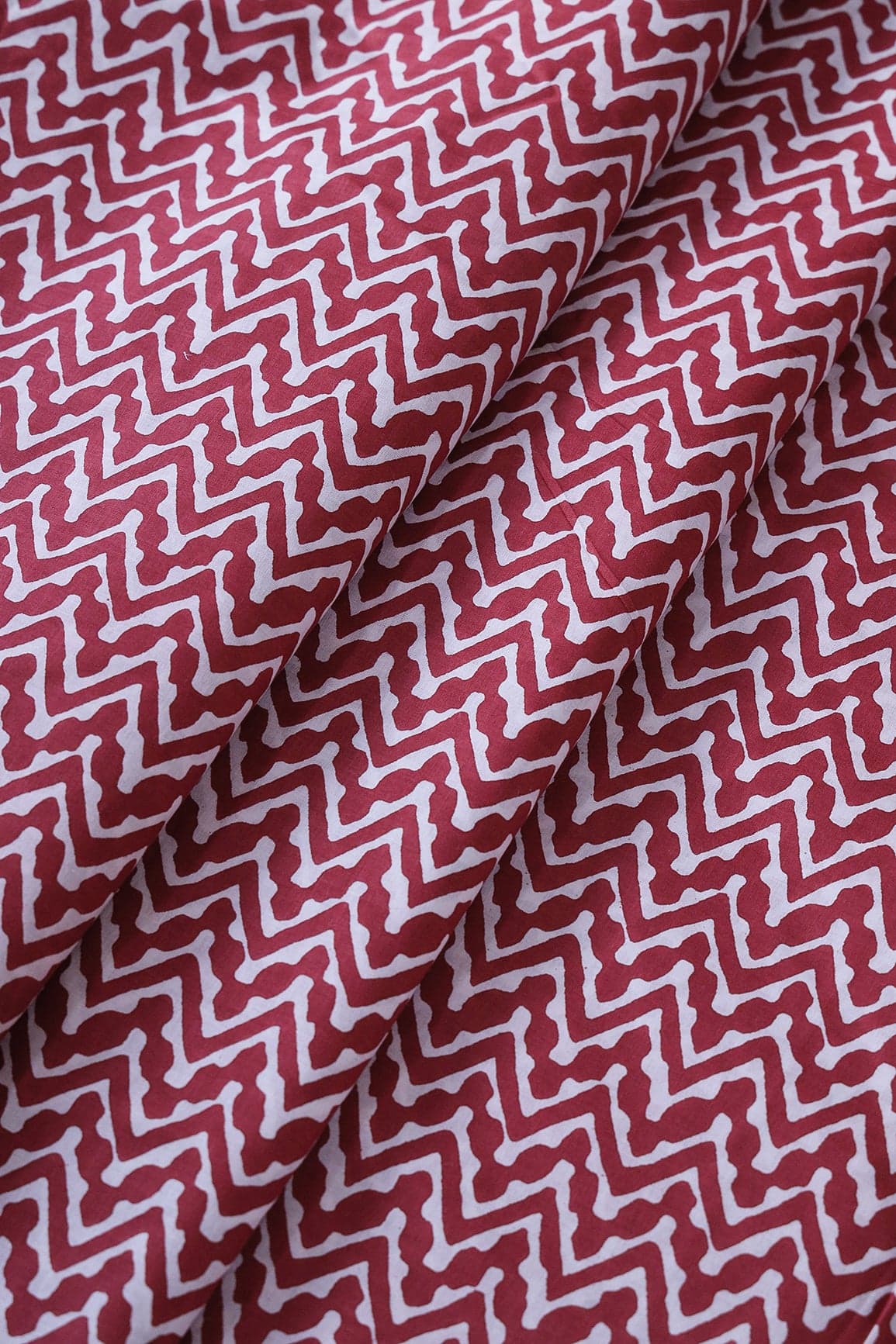 doeraa Prints White Chevron Pattern Print On Maroon Pure Cotton Fabric