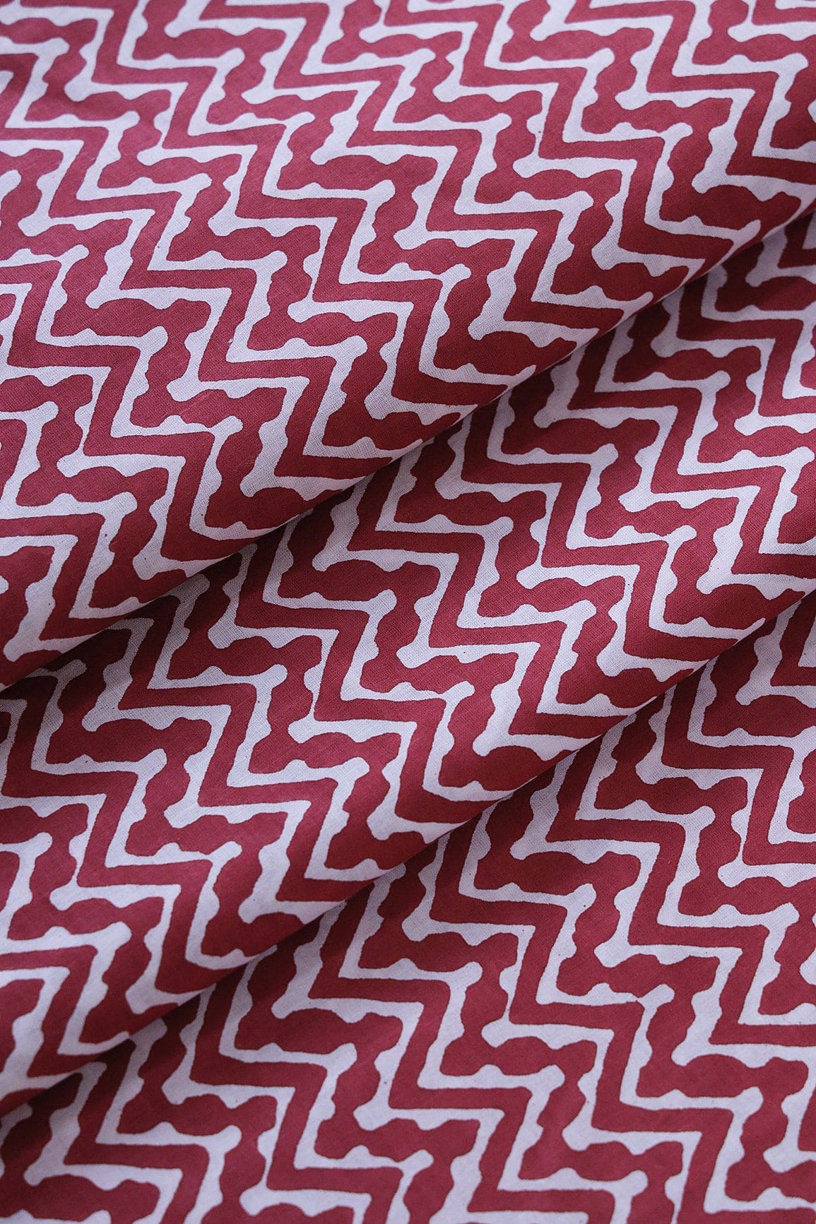 doeraa Prints White Chevron Pattern Print On Maroon Pure Cotton Fabric