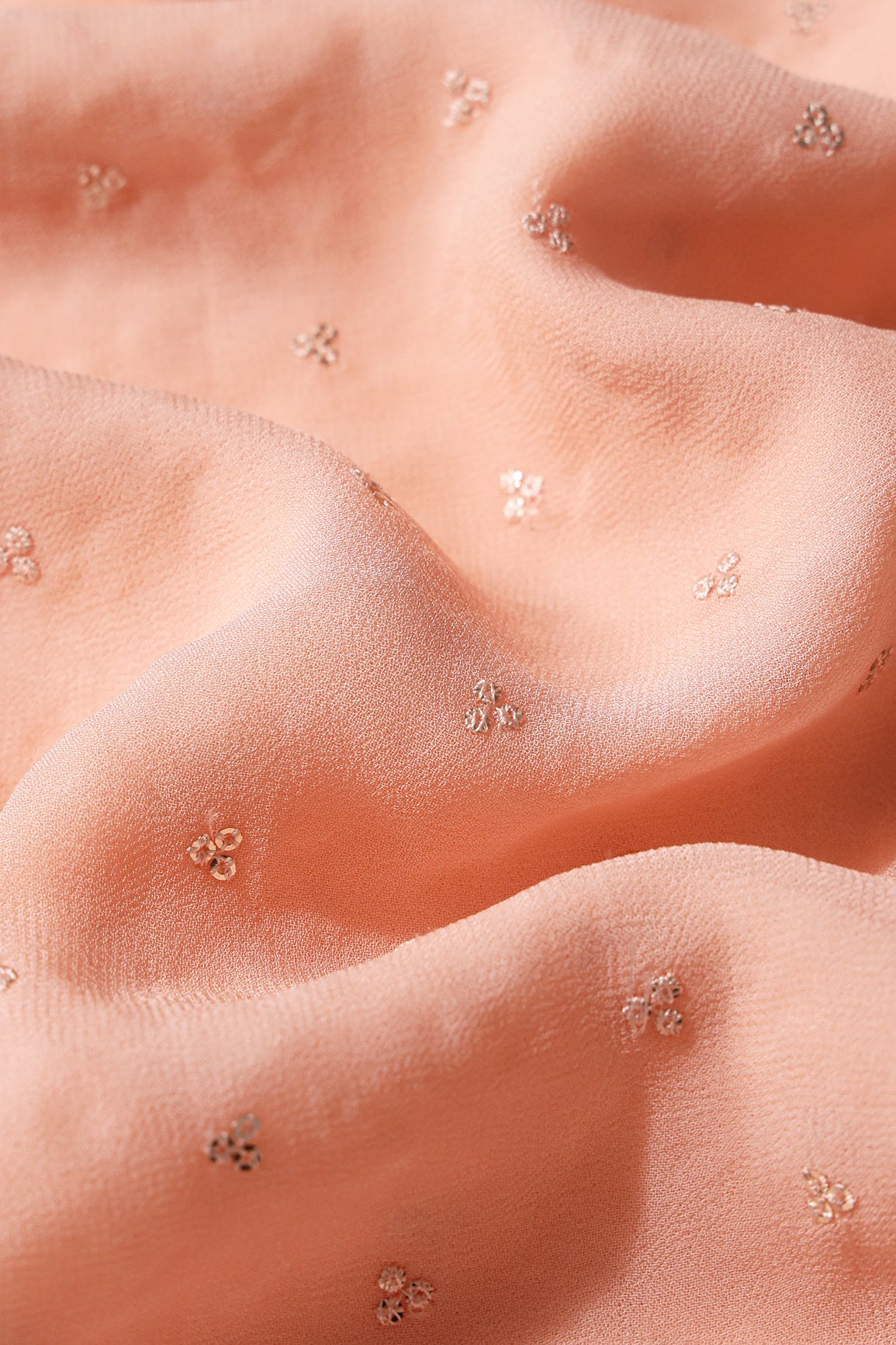 Small Motif Sequins Embroidery On Peach Viscose Georgette Fabric - doeraa