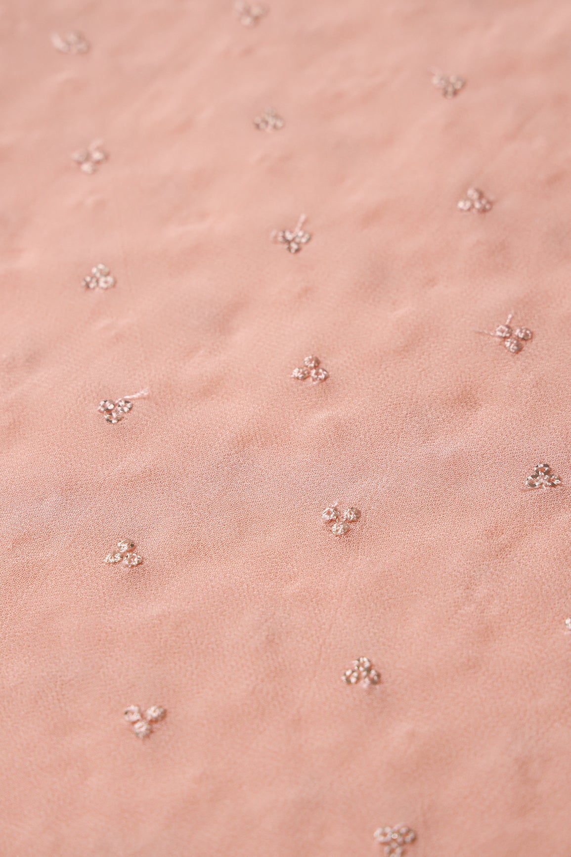Small Motif Sequins Embroidery On Peach Viscose Georgette Fabric - doeraa