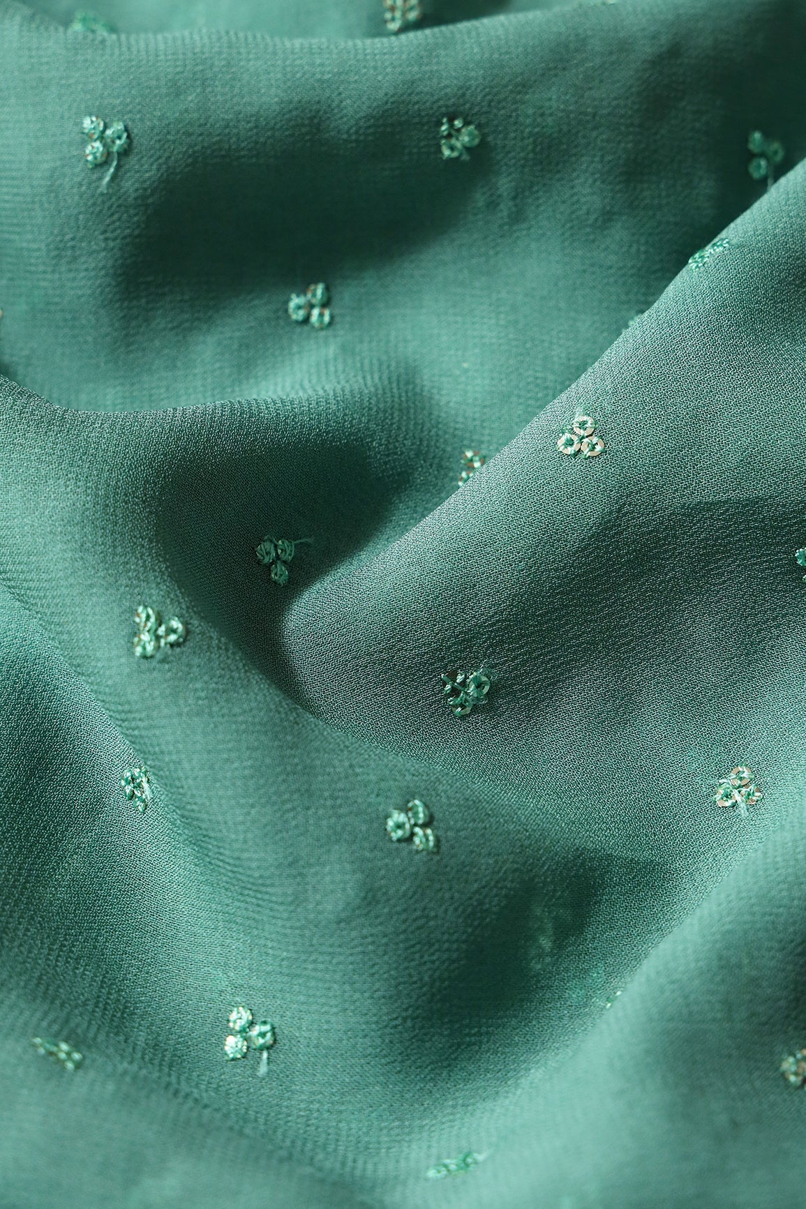 Small Motif Sequins Embroidery On Teal Viscose Georgette Fabric - doeraa