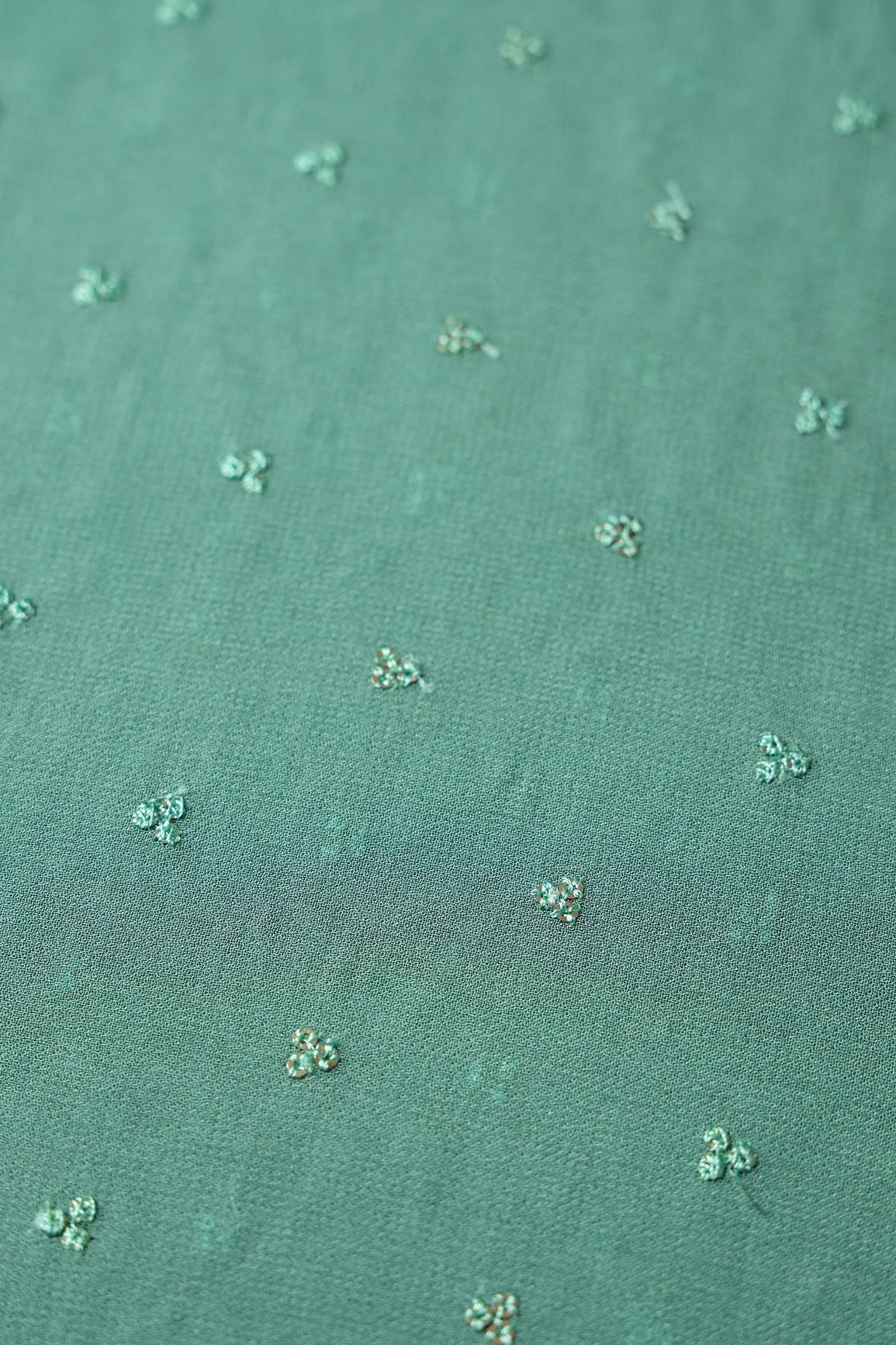 Small Motif Sequins Embroidery On Teal Viscose Georgette Fabric - doeraa