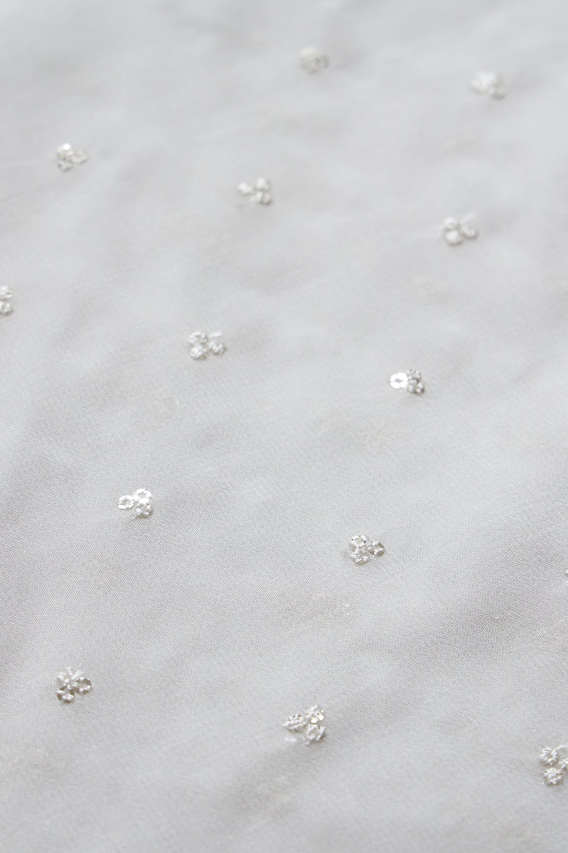 Small Motif Sequins Embroidery On White Dyeable Viscose Georgette Fabric - doeraa