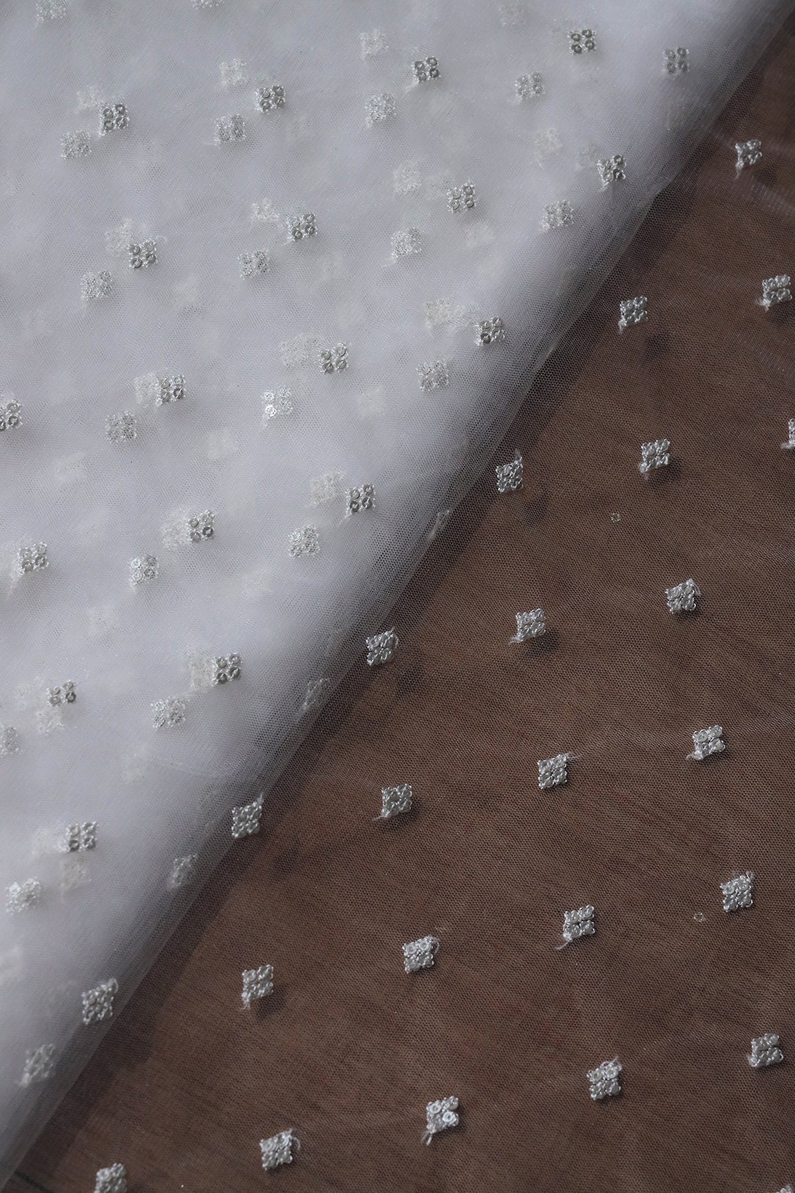 Small Motif Sequins Embroidery Work On White Dyeable Soft Net Fabric - doeraa