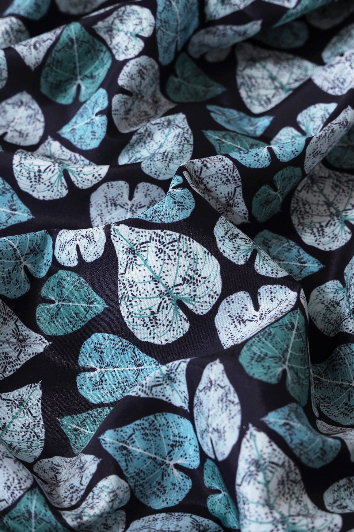 White And Teal Leafy Pattern Digital Print On Dark Navy Blue French Crepe Fabric - doeraa