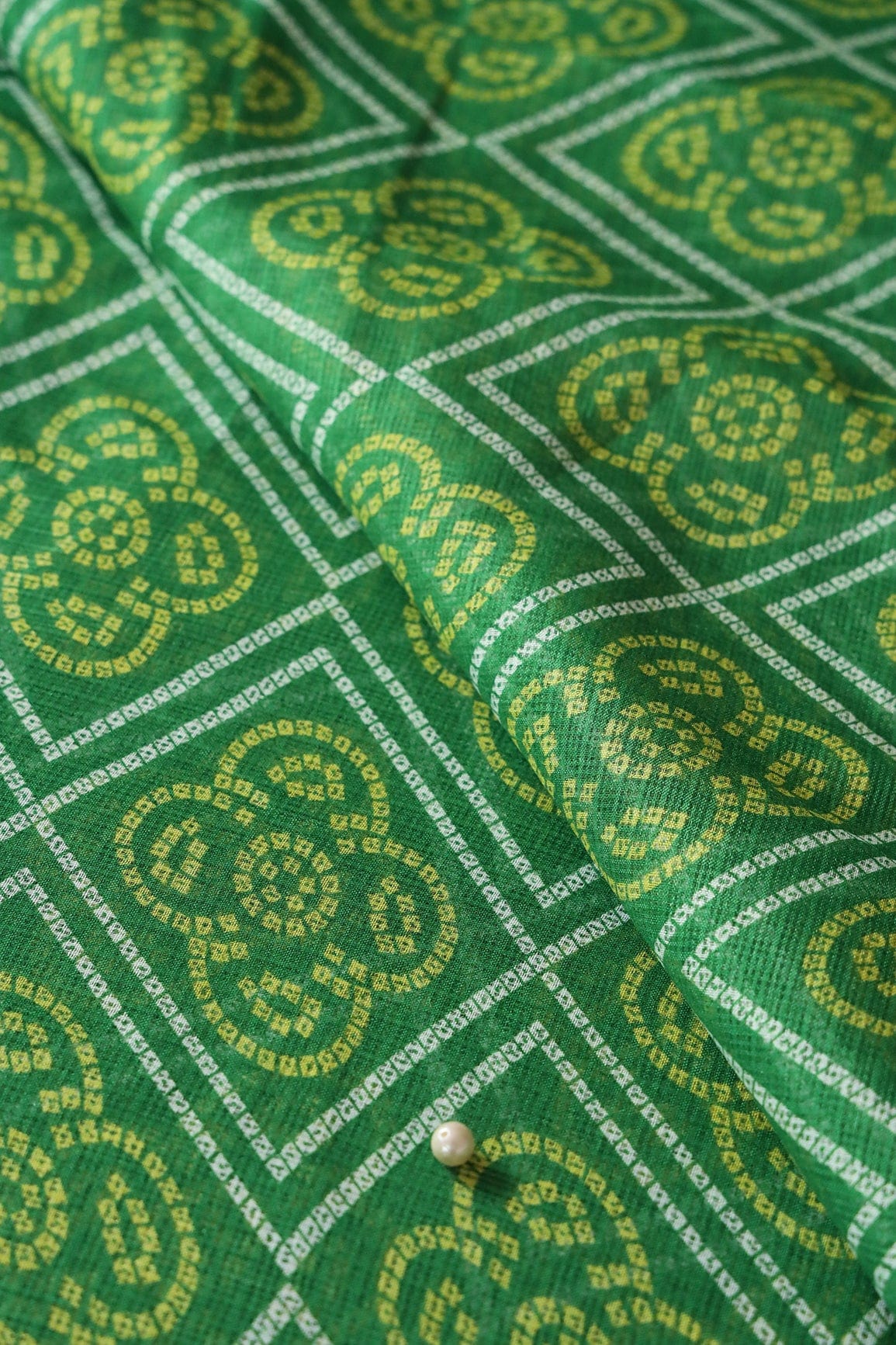 White And Yellow Bandhani Print On Green Kota Doria Fabric - doeraa