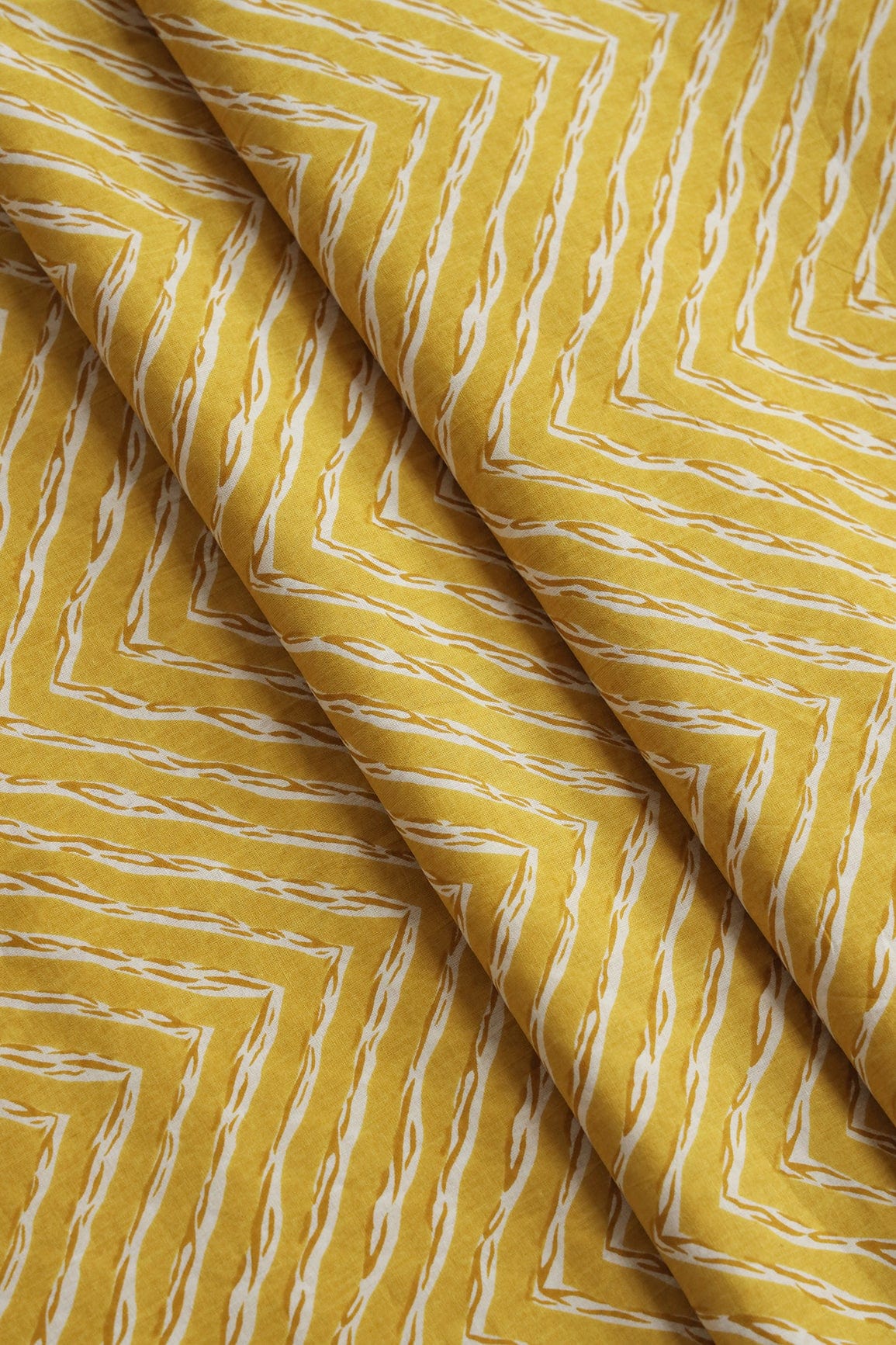 doeraa Prints Mustard And White Chevron Print On Pure Mul Cotton Fabric