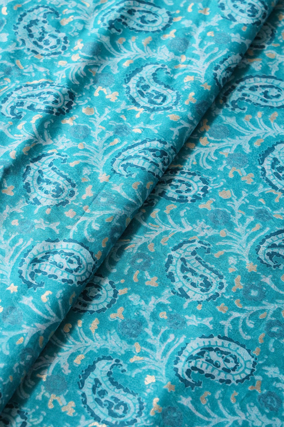 doeraa Prints Turquoise Paisley Pattern With Foil Print On Pure Mul Cotton Fabric