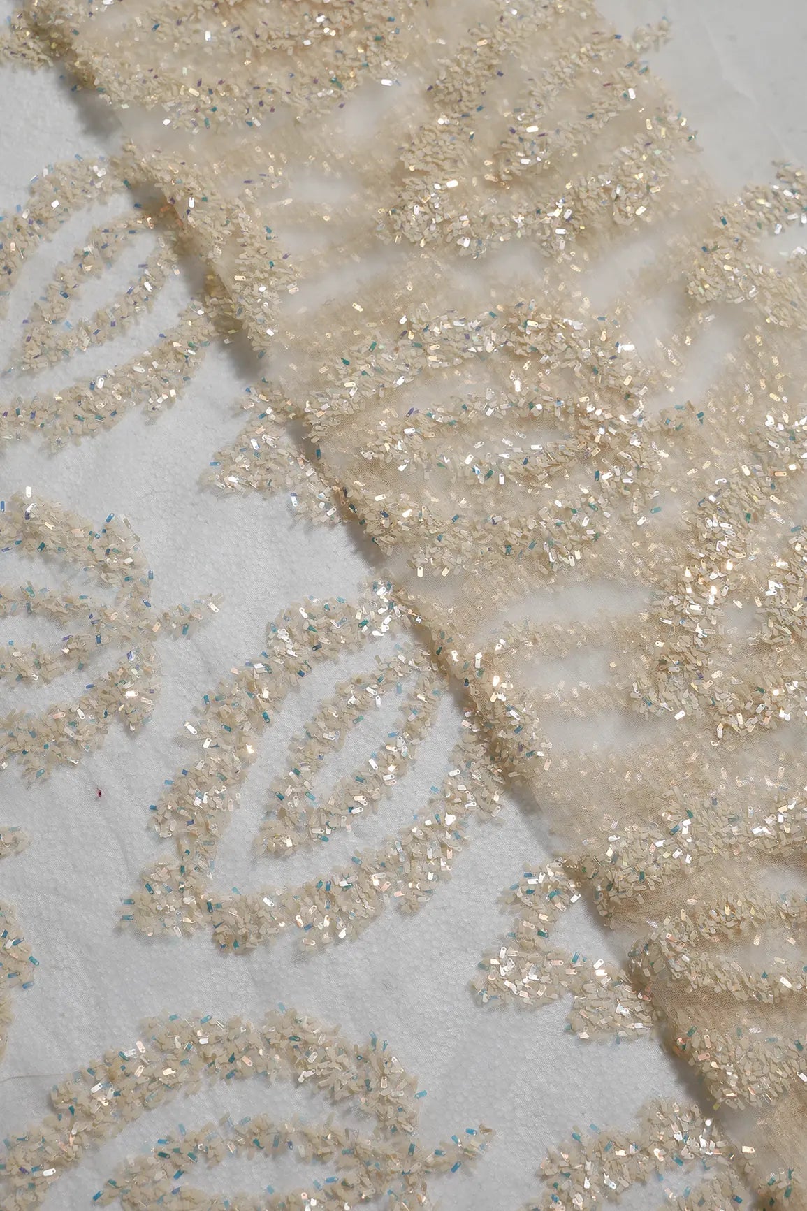 1 Meter Cut Piece Of Oval Sequins Abstract Embroidery Work On Cream Soft Net Fabric - doeraa