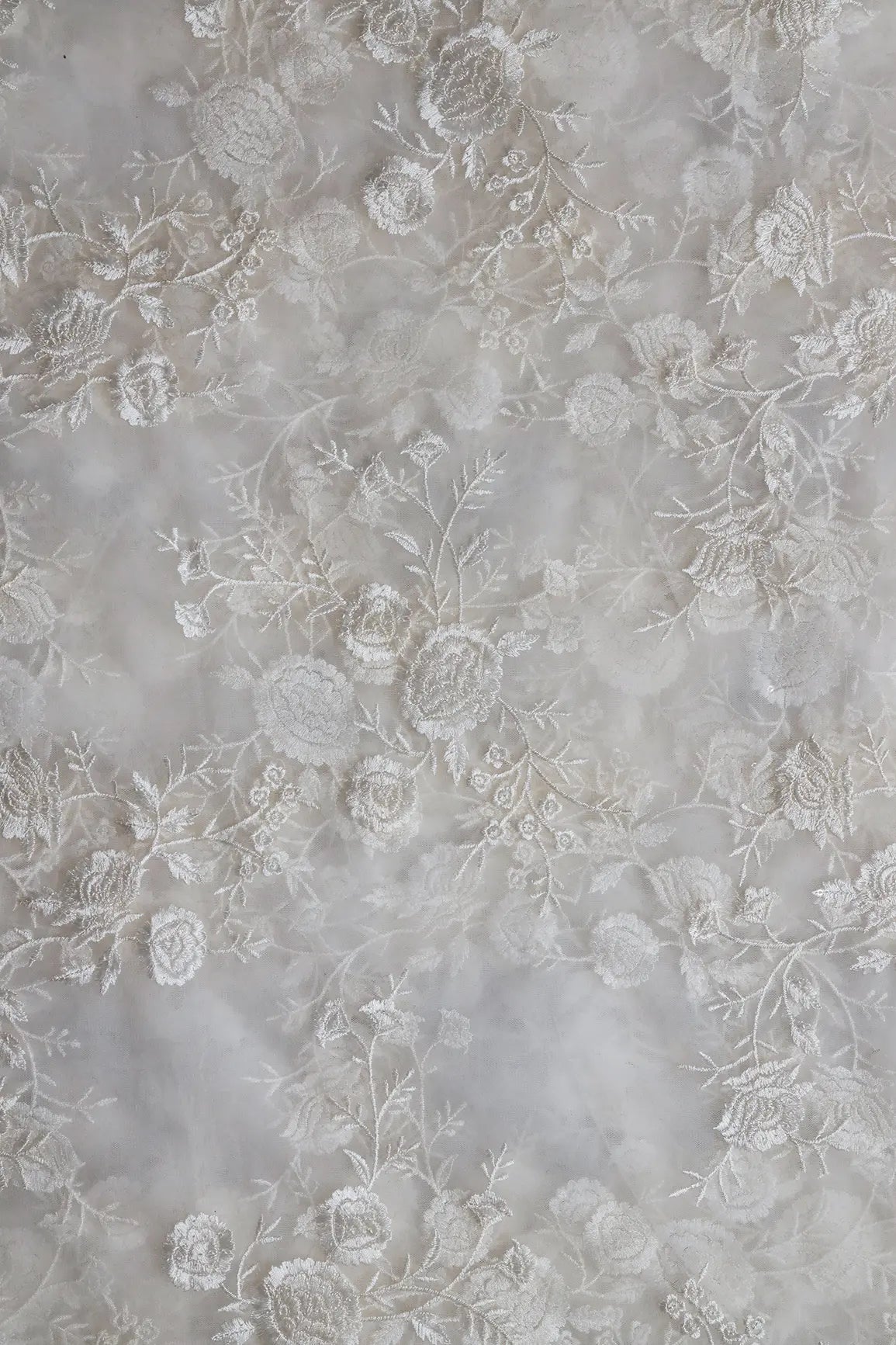 White Thread With Sequins Floral Embroidery On White Dyeable Soft Net Fabric