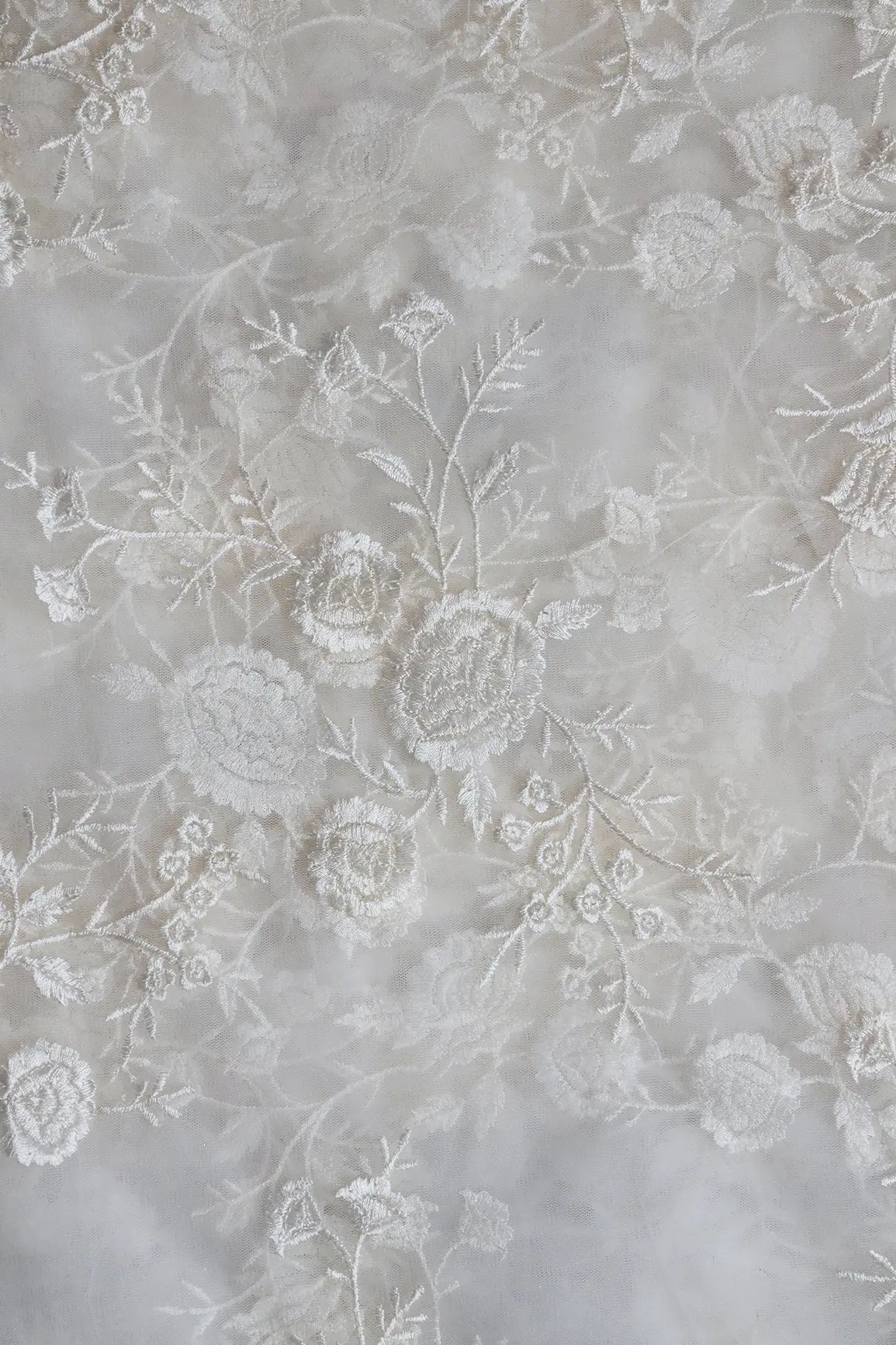 White Thread With Sequins Floral Embroidery On White Dyeable Soft Net Fabric