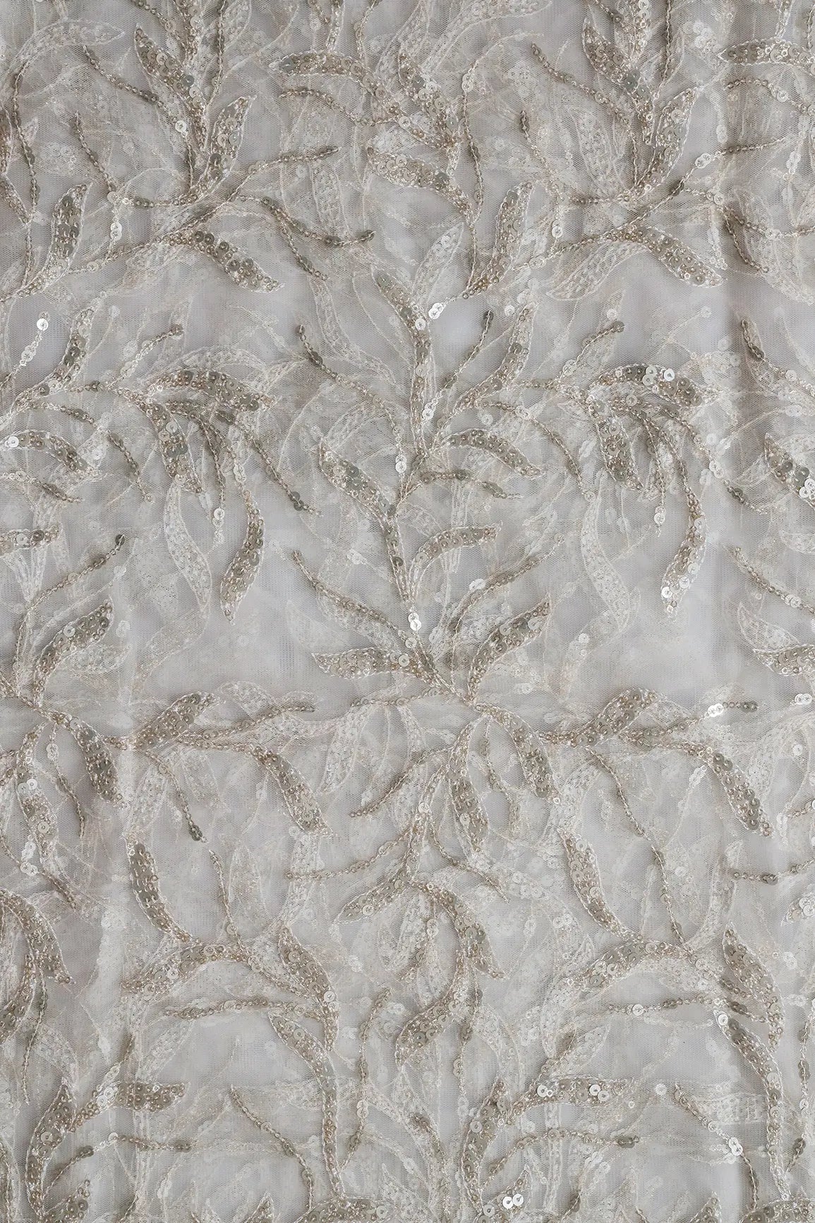 Gold And Silver Sequins Leafy Floral Embroidery On Dyeable White Soft Net Fabric