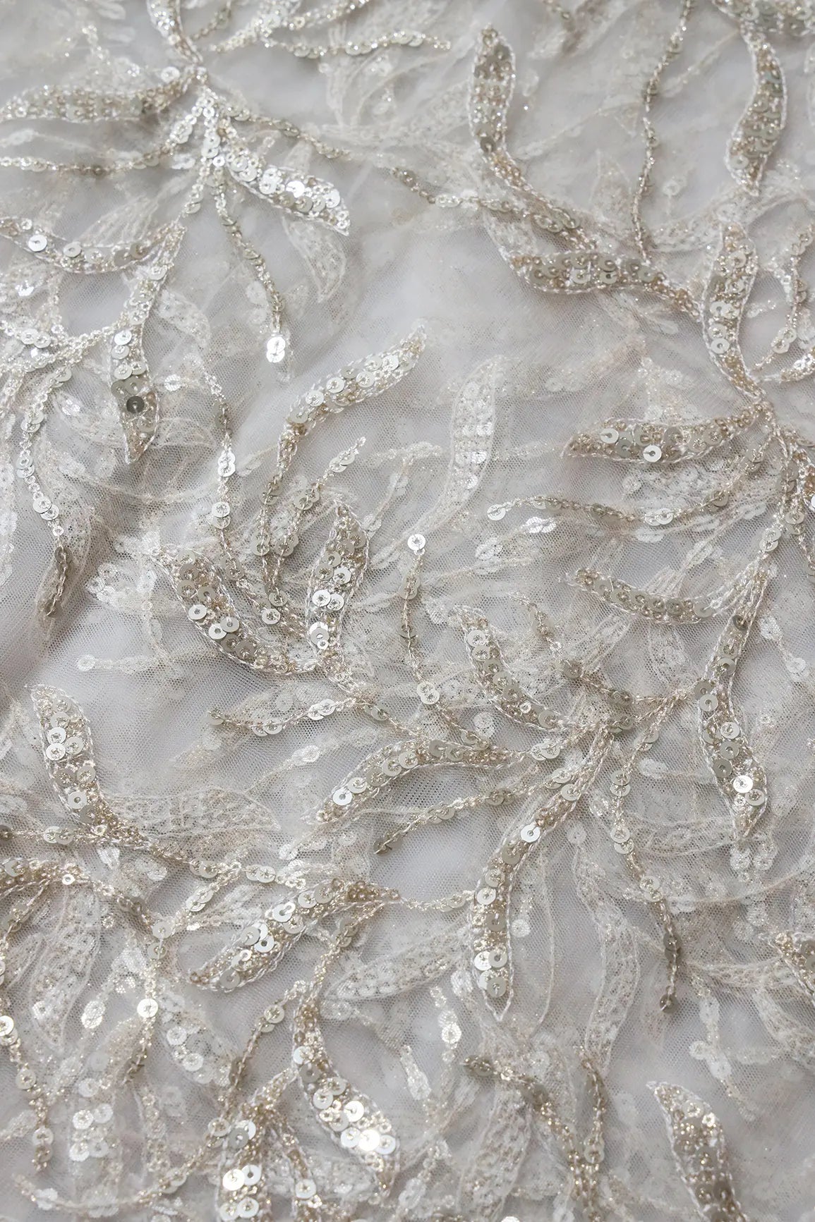 Gold And Silver Sequins Leafy Floral Embroidery On Dyeable White Soft Net Fabric